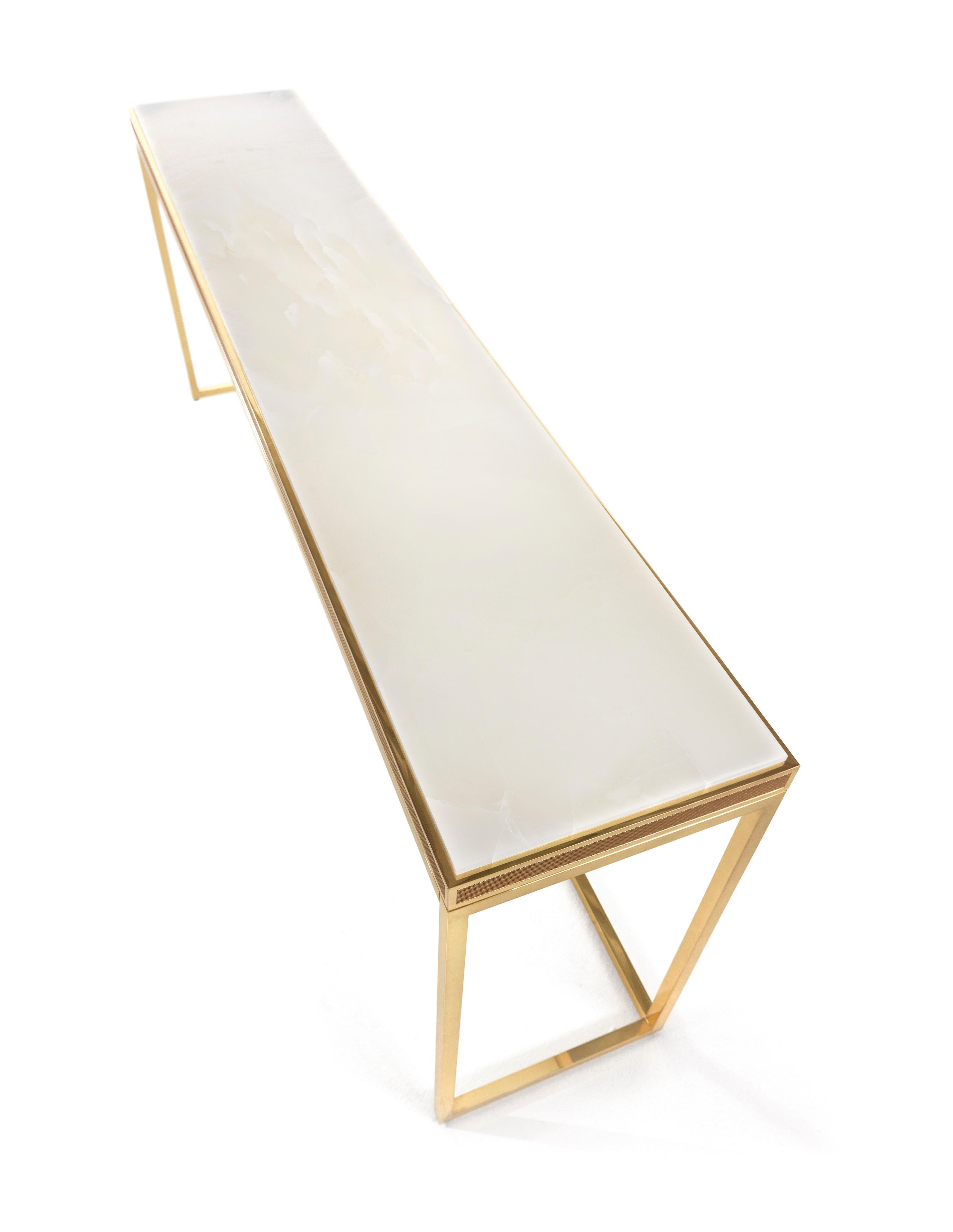 Elegant and refined, with its simple and linear shapes, Dedalus console features a brass structure with a glossy finish, an engraved frame and a marble top. Inspired by the art deco style, thanks to its versatility it adapts perfectly to classic or