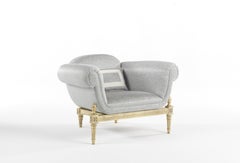 Sillón Enigma Siglo XXI de madera y tela