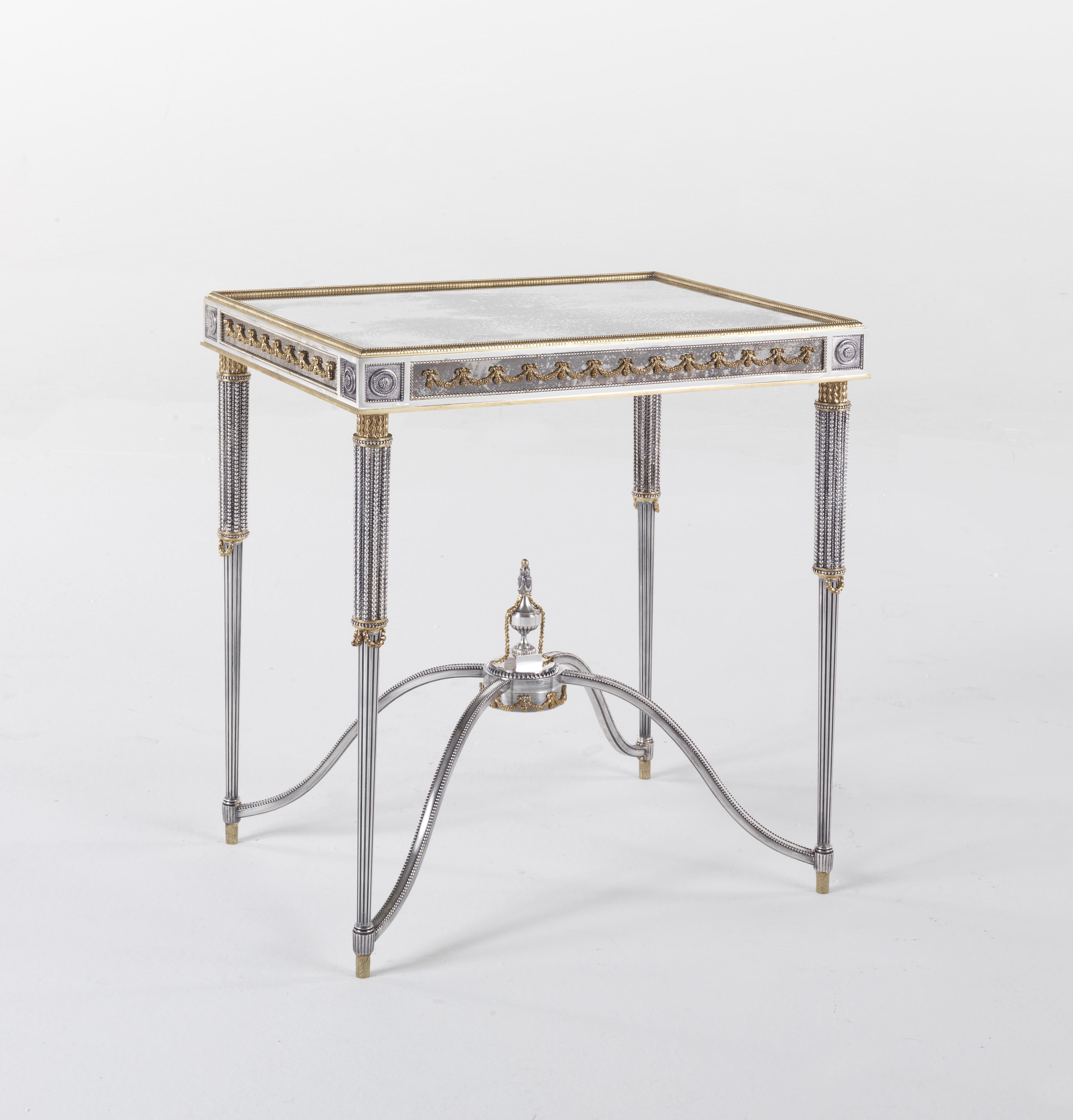An elegant and luxurious baroque style for Eos coffee table. Characterized by a brass structure with decorative lost-wax cast elements finished in antiqued brass and silver, this coffee table is a precious piece of furniture, able to enhance