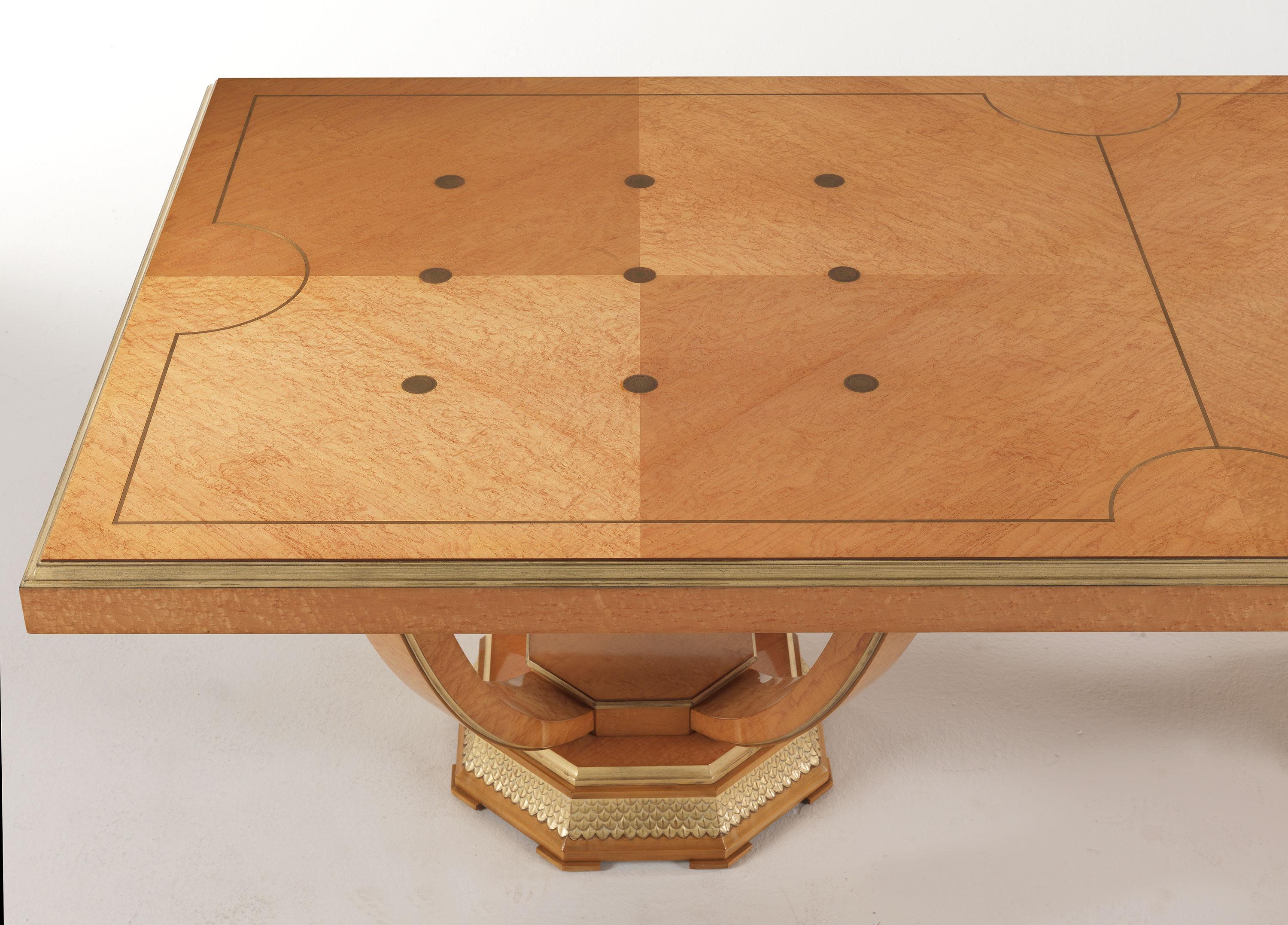 Pleasure is a line of furnishings characterized by an elegant and refined charm. The dining table of the collection, with an art deco design, features a sculptural base, while the top is embellished by brass inlays. The details in patinated antiqued