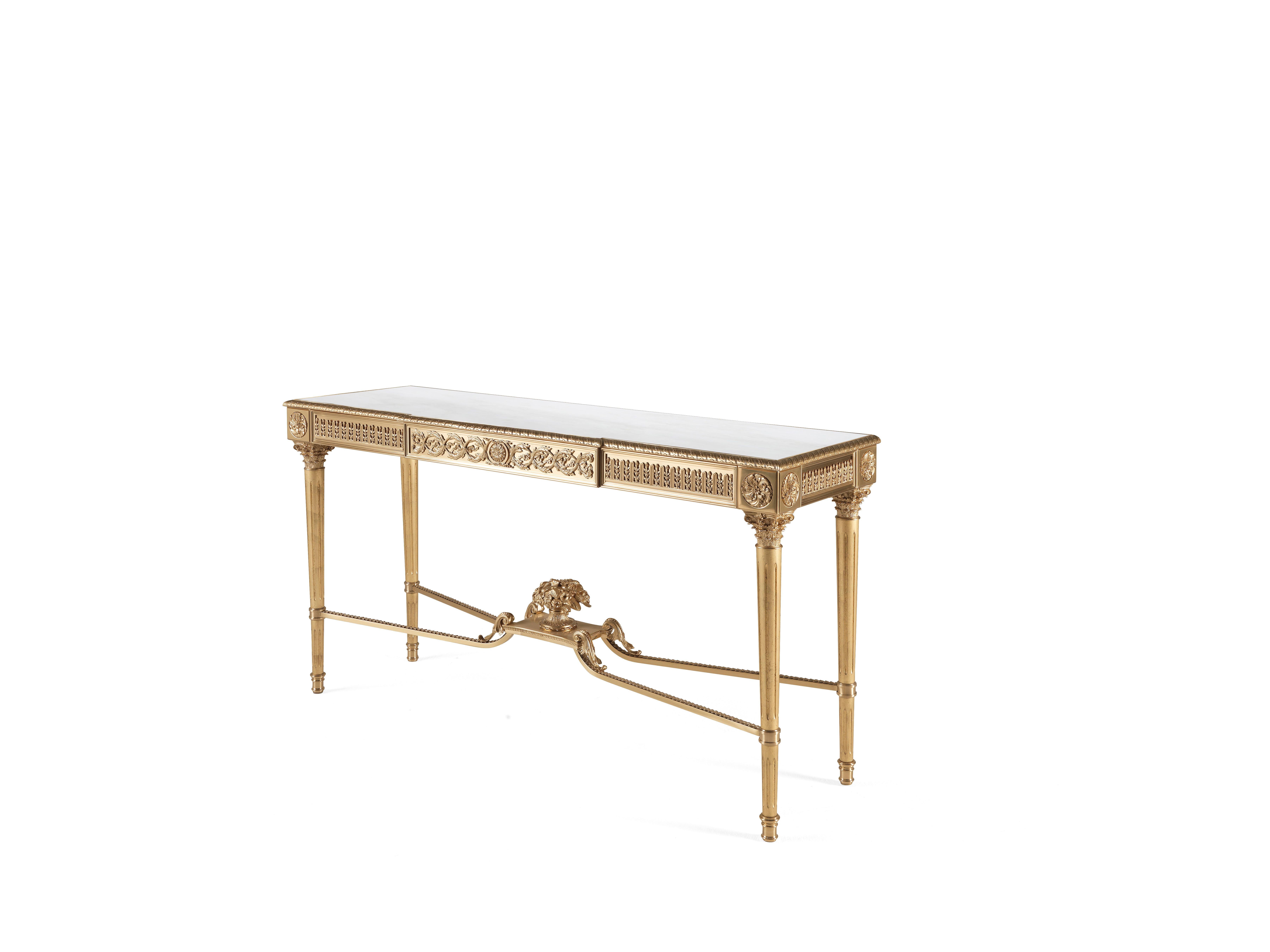 Perfect expression of manual and artistic skill, Shogun is made of brass with lost-wax cast brass details. The piece of furniture is characterized by finely carved legs with gold finishing and a cross that ends with an elegant central cup. The top