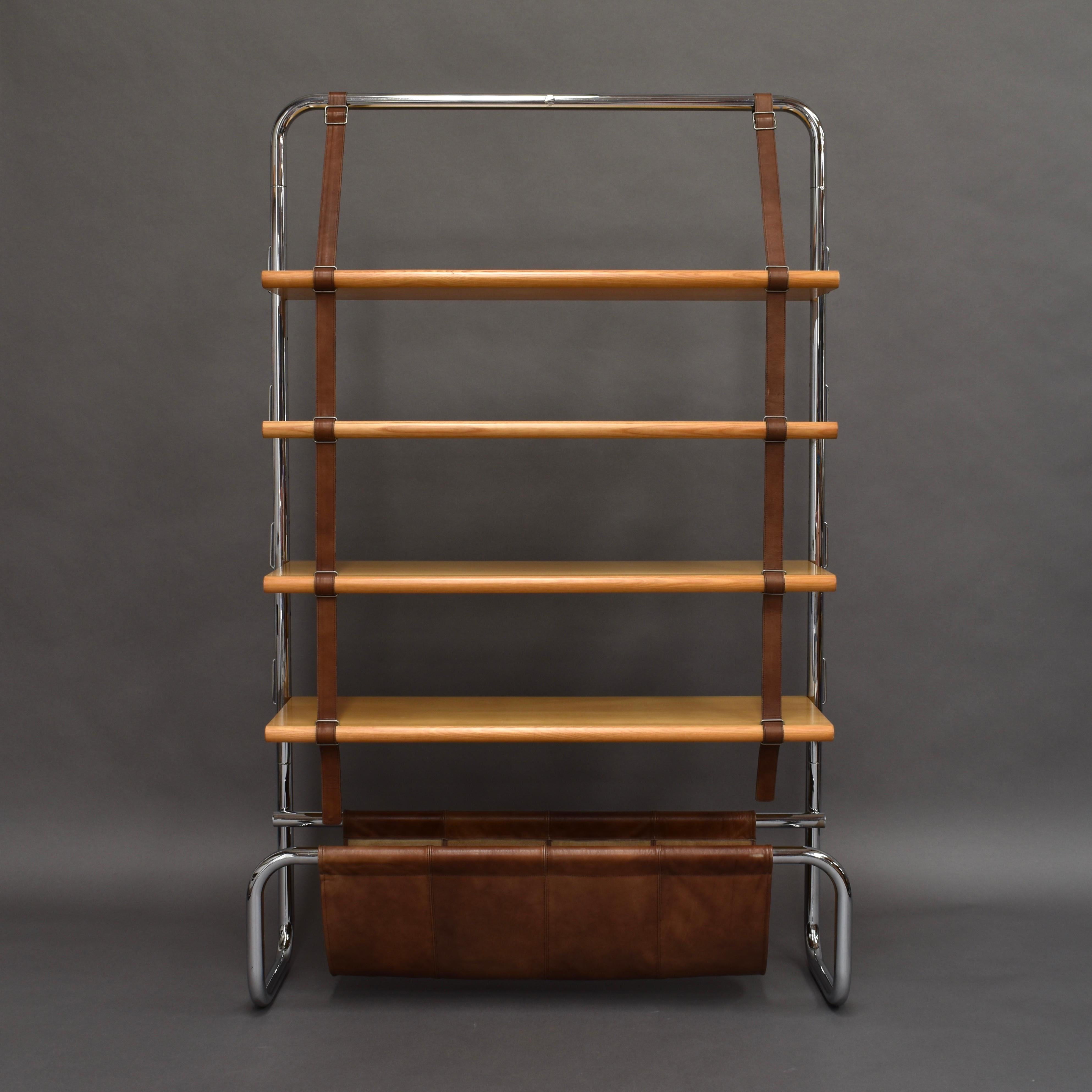 Extraordinary ‘Jumbo’ bookcase by Luigi Massoni for Poltrona Frau in Birch, chrome and leather, Italy, 1971.

This stunning bookshelf is very rare and features a tubular chrome frame, four Birch shelves, brown leather straps and leather magazine