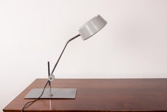 Jumo desk lamp with pendulum, articulable, in metal by Charlotte Perriand.