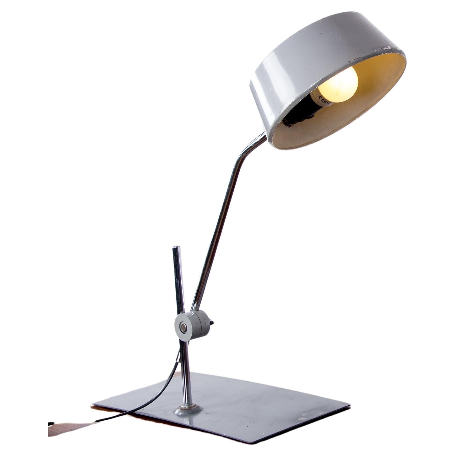 Jumo desk lamp with pendulum, articulable, in metal by Charlotte Perriand.