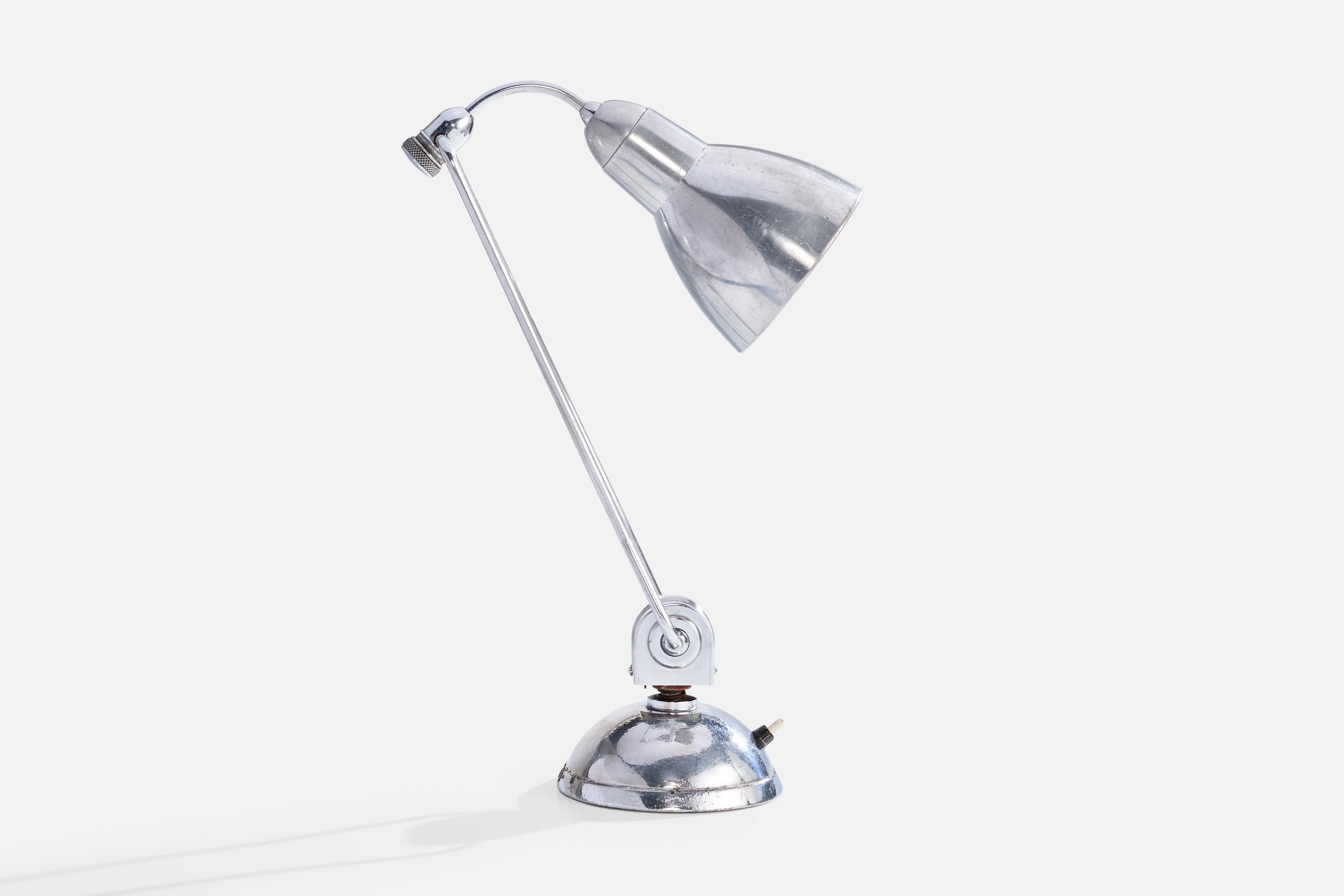 An adjustable chrome metal table lamp produced by Jumo, France, c. 1940s.

Oxidation present to metal

Wear consistent with age and use

Neck and shade are adjustable; measured as shown

Dimensions of Lamp (inches): 18.25