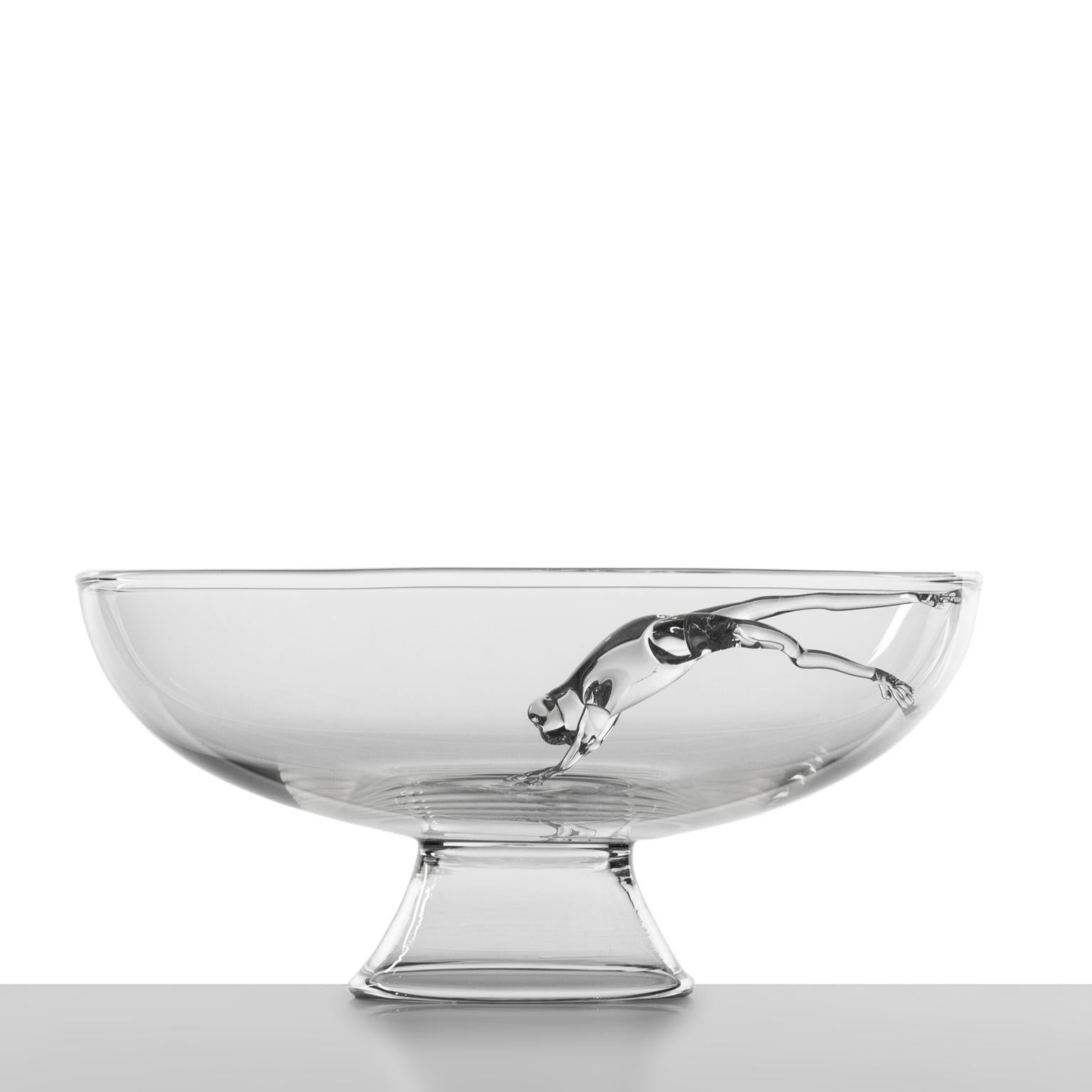'Jumping Frod'
A hand blown glass bowl by Simone Crestani.

The vitality of a tiny frog is captured in a leap stopped in time. A dart trapped in a pool of water is transformed into a centerpiece. Light and slight this middle creature between