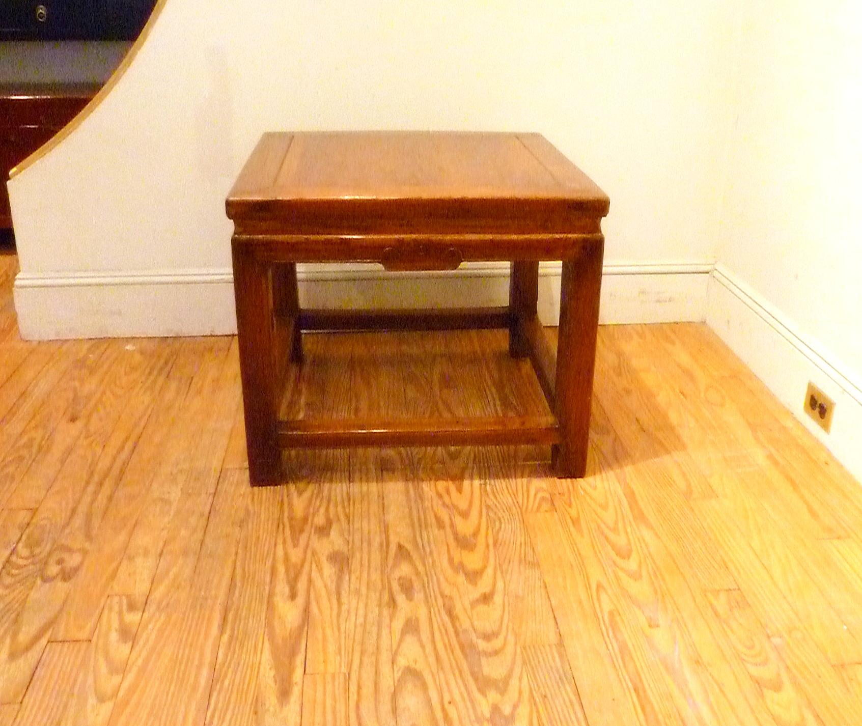 Jumu wood square side table with relief carving on apron and stretchers on hoof feet. Price is for the table only.