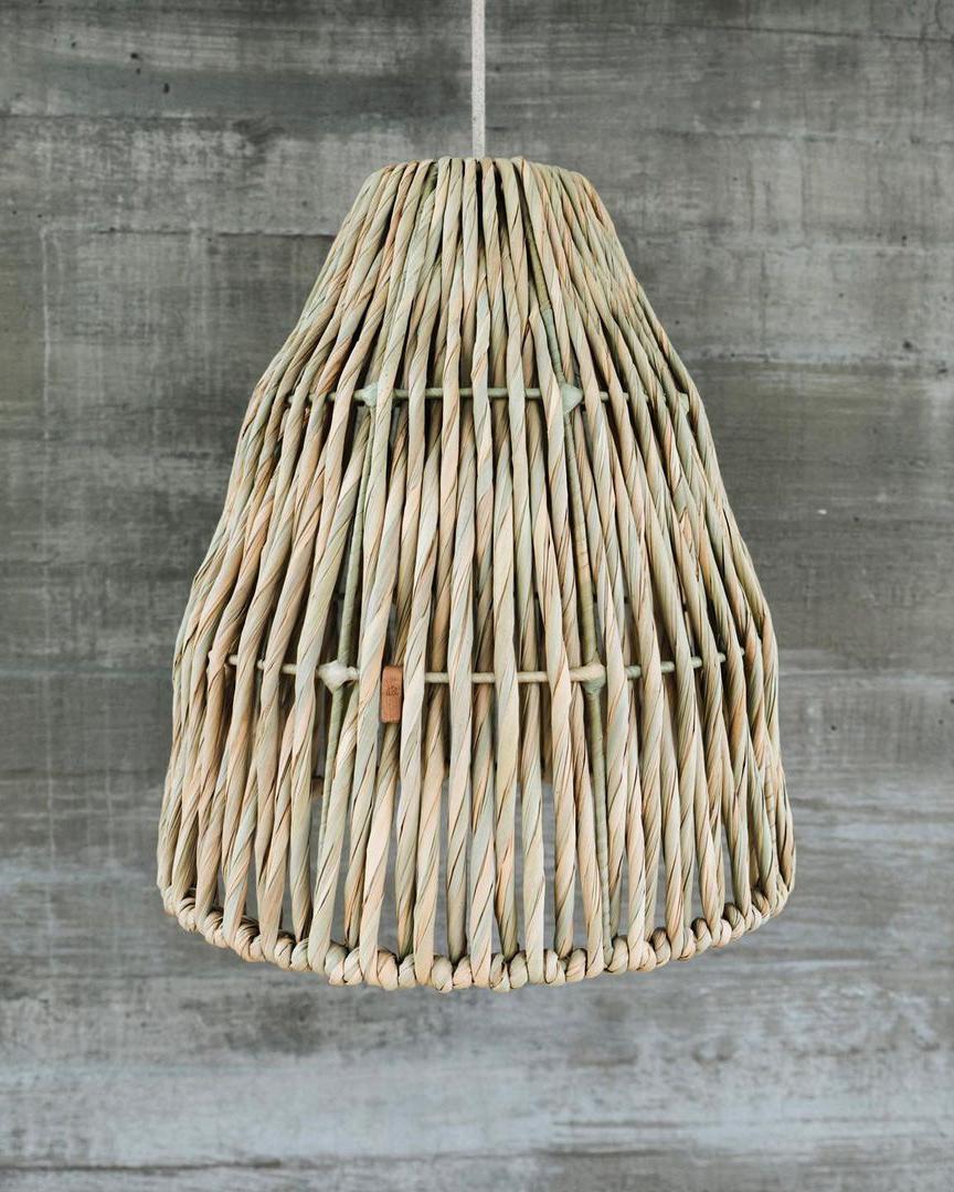 Modern and rustic, the handmade Juncal Palm Lampshade adds an organic, natural feel to any room. Made with warm beige natural fibers, this pendant casts a bright glow to your home and create a beautiful home decor aesthetic that will complement your