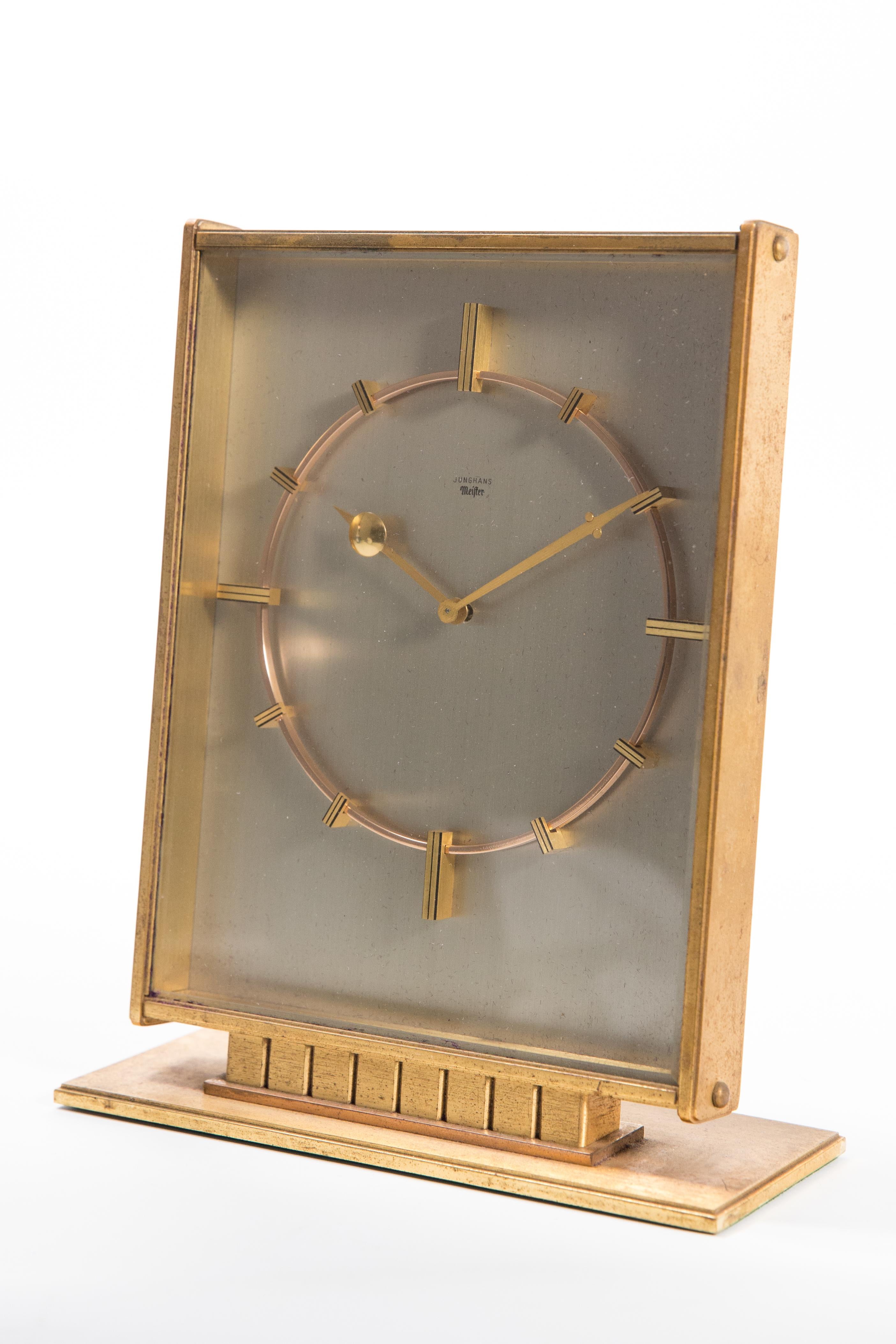 Offered is Junghans Mid-Century Modern large vintage desk clock with ruby 14 jewel movement made for and retailed by the respected Oslo Jeweler, Brodr Bjerke. The clock is an excellent example of the modernist design and comes with it’s original