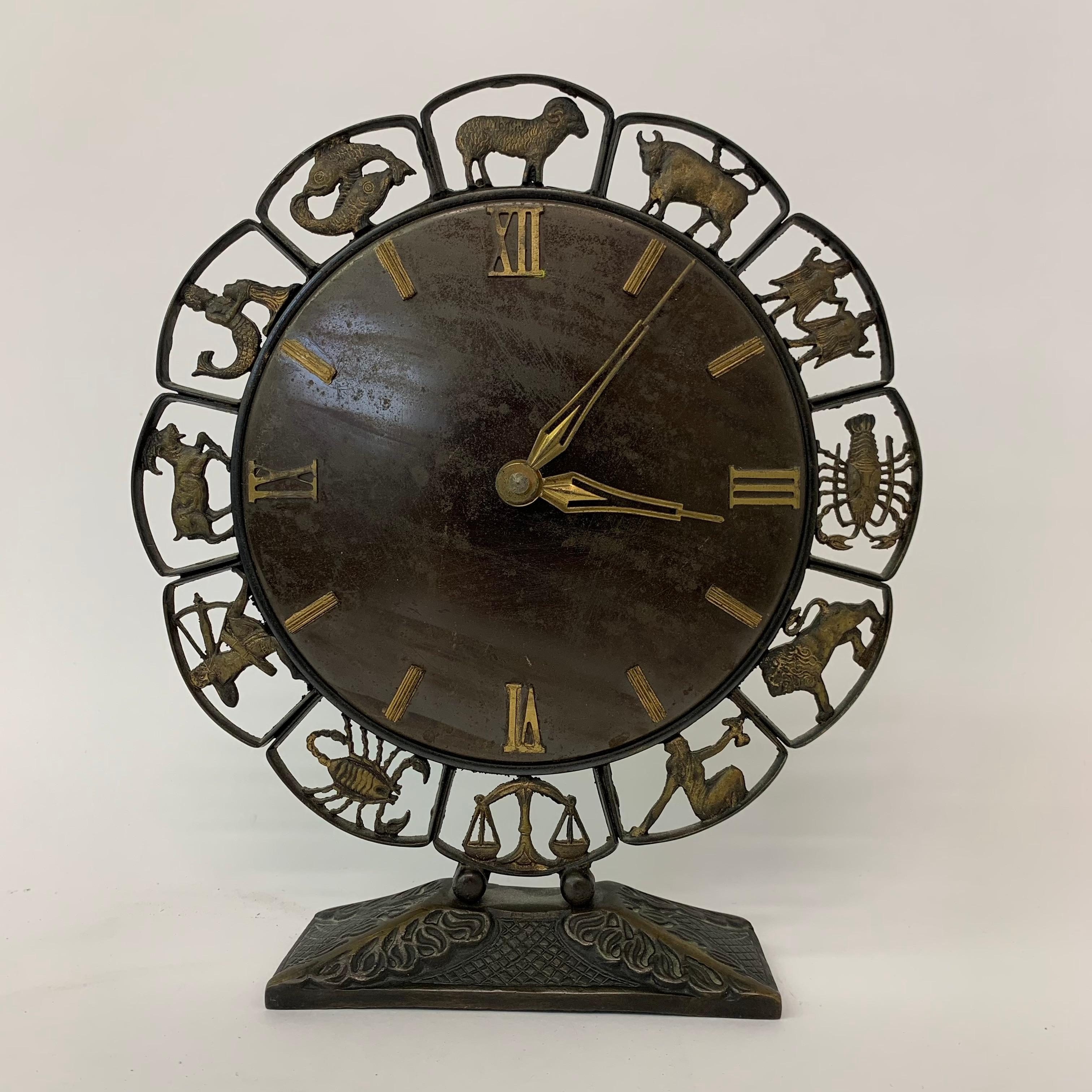 Junghans modernist Zodiac clock, 1970’s

Dimensions: 24,5cmW, 27cm H, 6cm D
Condition: Good
Period: 1970’s