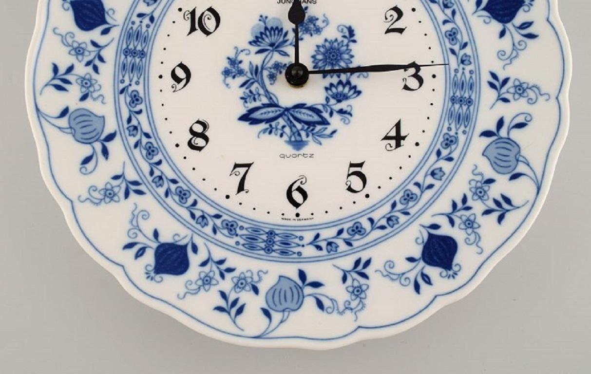 Late 20th Century Junghans porcelain wall clock. Meissen Blue Onion style. Germany, 1970s.