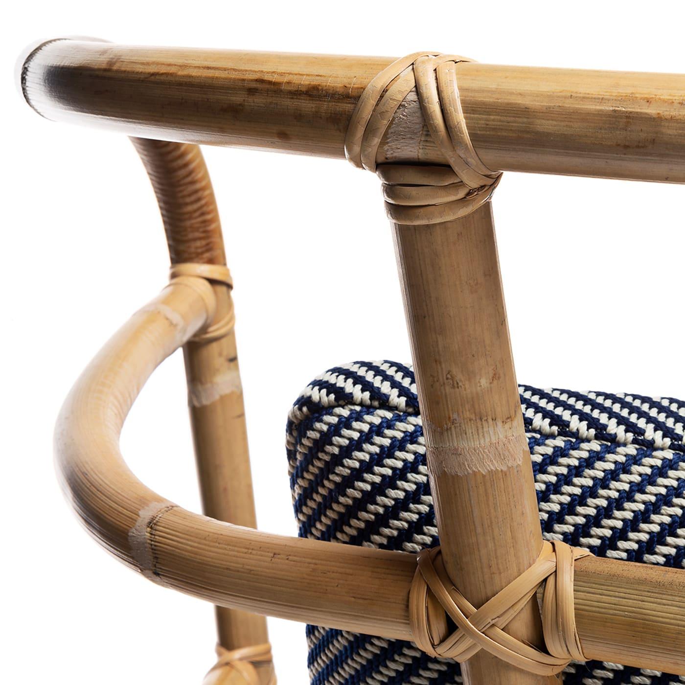 A singular piece of sophisticated value, this design belongs to the Jungle Collection by Massimo Castagna. Distinguished by a stupendous bamboo cane backrest that enhances its natural inspiration, it features a softly padded seat upholstered with