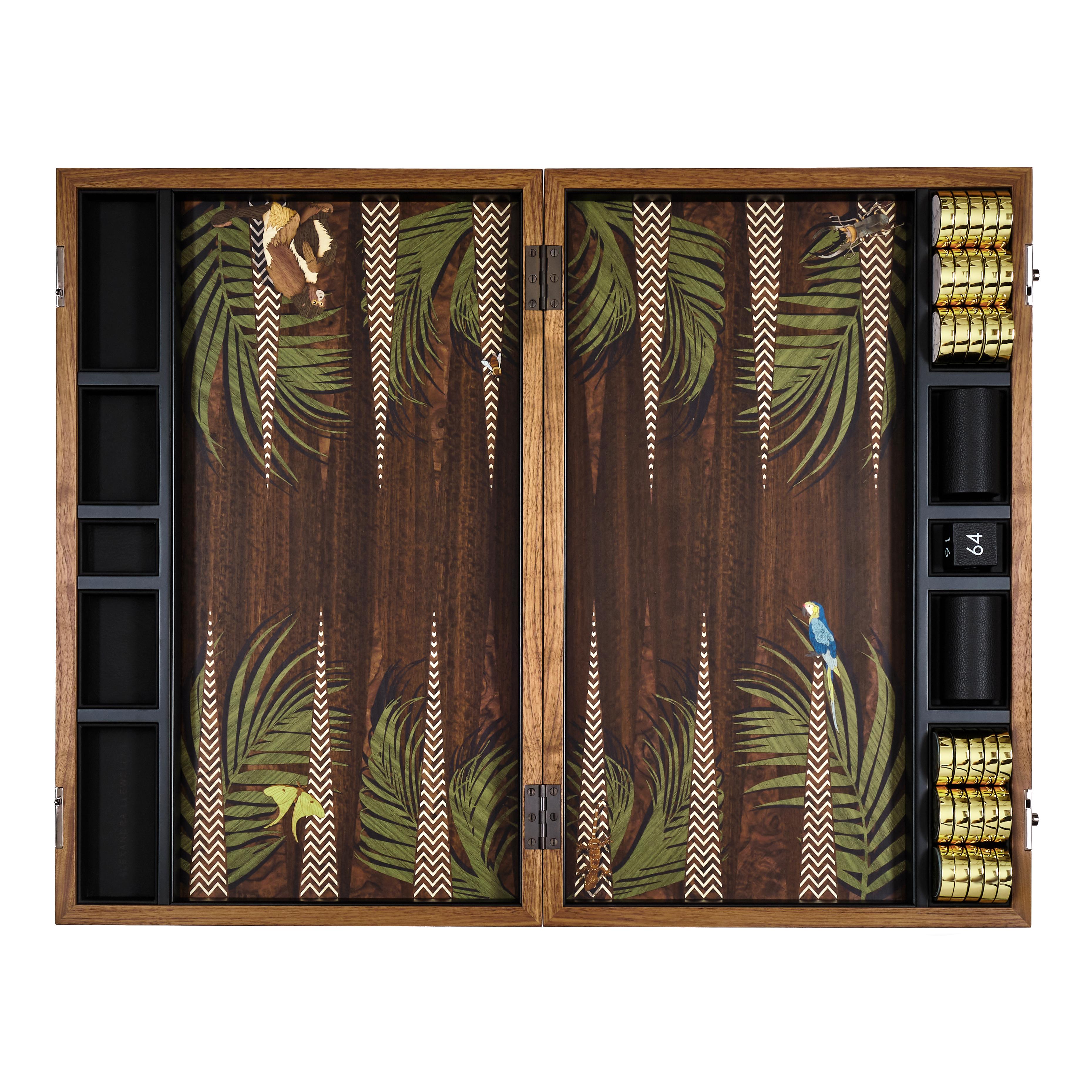 Our Jungle backgammon set is crafted across 9 different heritage craft workshops in the UK and reflects hundreds of hours of design, passion, and craft. The set comes with wrapped weighted burgundy and cream calf leather playing pieces. The exotic