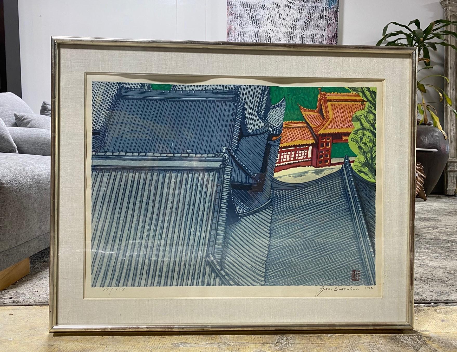 A wonderfully composed and richly colored, limited edition woodblock print by famed Japanese artist Junichiro Sekino.

This relatively large print, which is of a rooftop view of a temple shrine in Japan (perhaps Nagasaki as he did a similar print