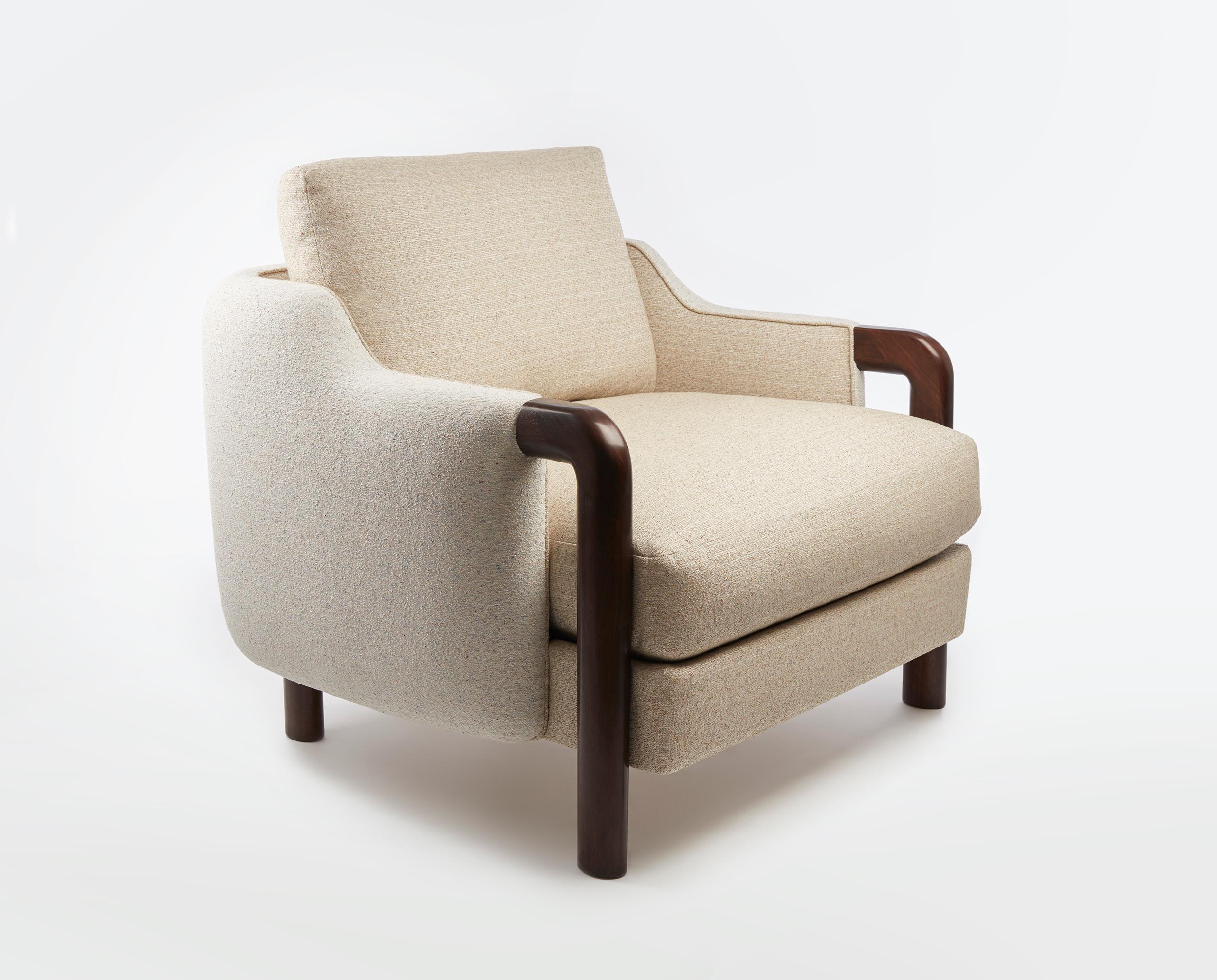Junior Armchair by Gisbert Pöppler
Dimensions: H 82 (SH43) x W 84 x D 81,5 cm
Materials: American walnut, coil springs upholstered with padding and down

A place in the clouds! The Junior Chair is all about comfort. The low seating height, down