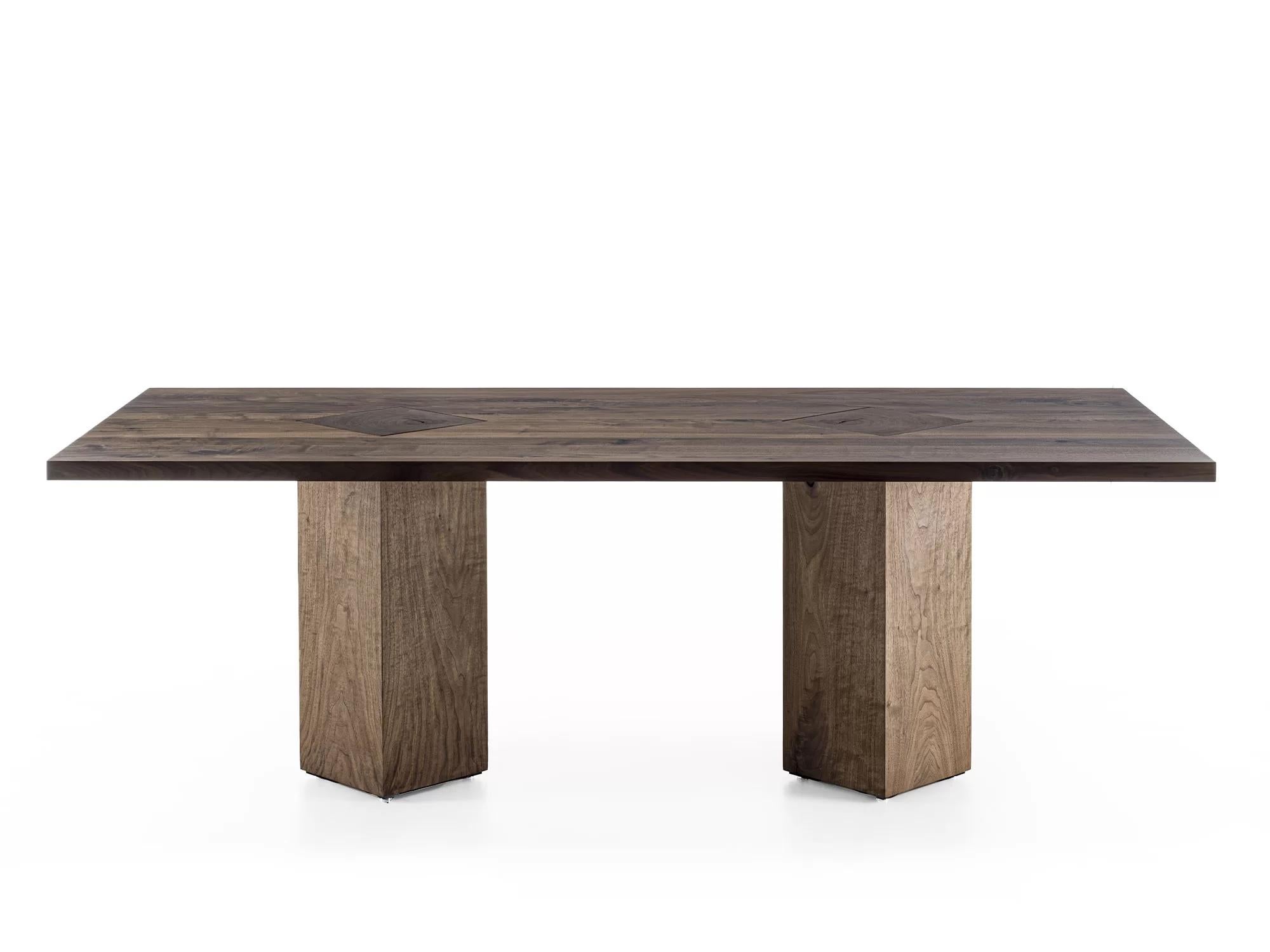 Table with a solid wood top with glued slats, characterized by its exposed legs, intersecting with the top, made from tree trunk sections, and rotated to a 45° angle.

Designed by Authentic Design and Made in Italy.
Many sizes offered, please