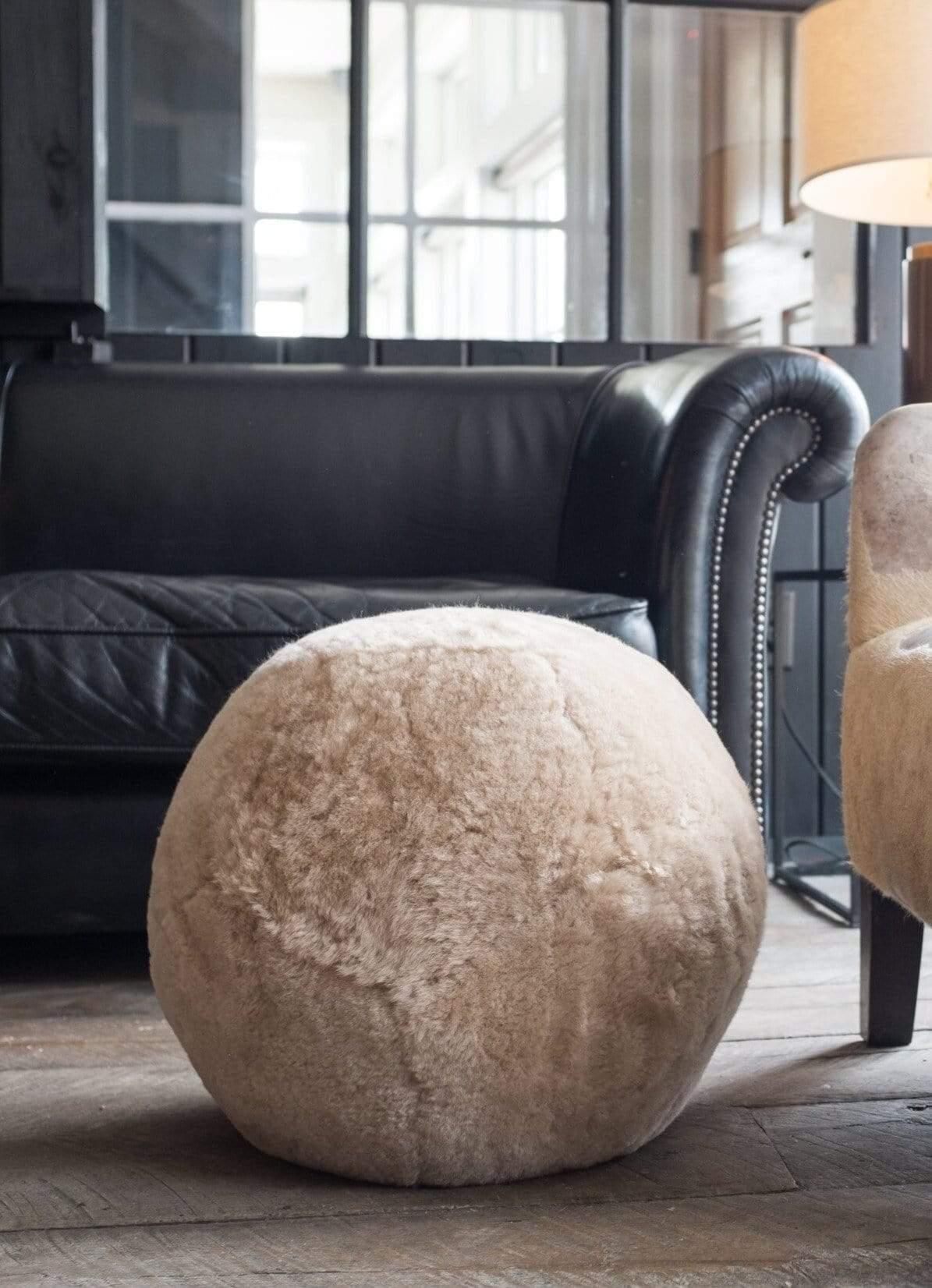 Encased in a magnificent shearling coat, this Moses Nadel Ottoman X Junior can be used as an ottoman or simply an everyday item with its unique abstractness. Admire the detail of the hand-laced enclosure, this ottoman is filled with firm foam to