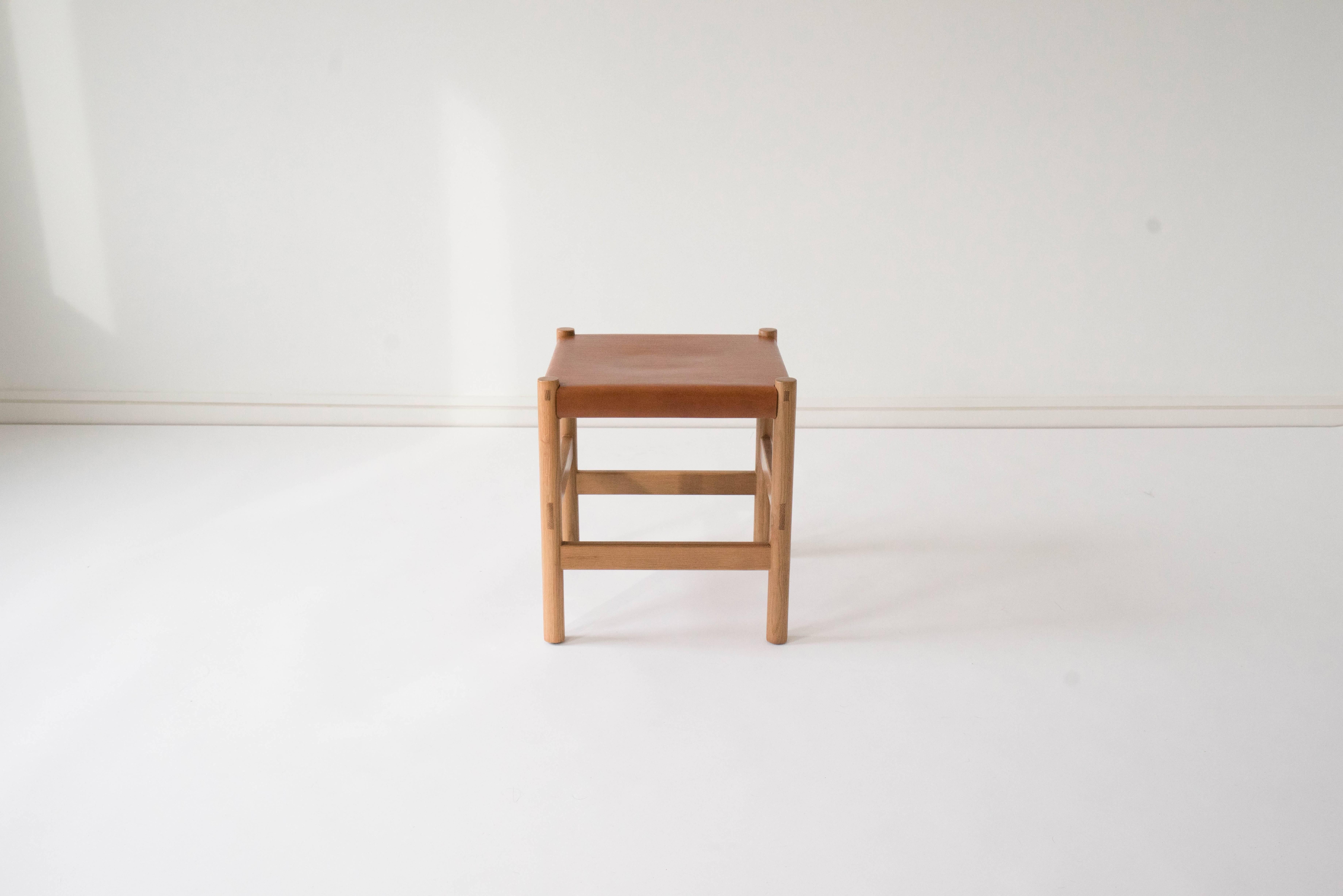 Sun at Six is a contemporary furniture design studio that works with traditional Chinese joinery masters to handcraft our pieces using traditional joinery. A simple, versatile stool. The vegetable tanned leather will patina with age. Exposed through