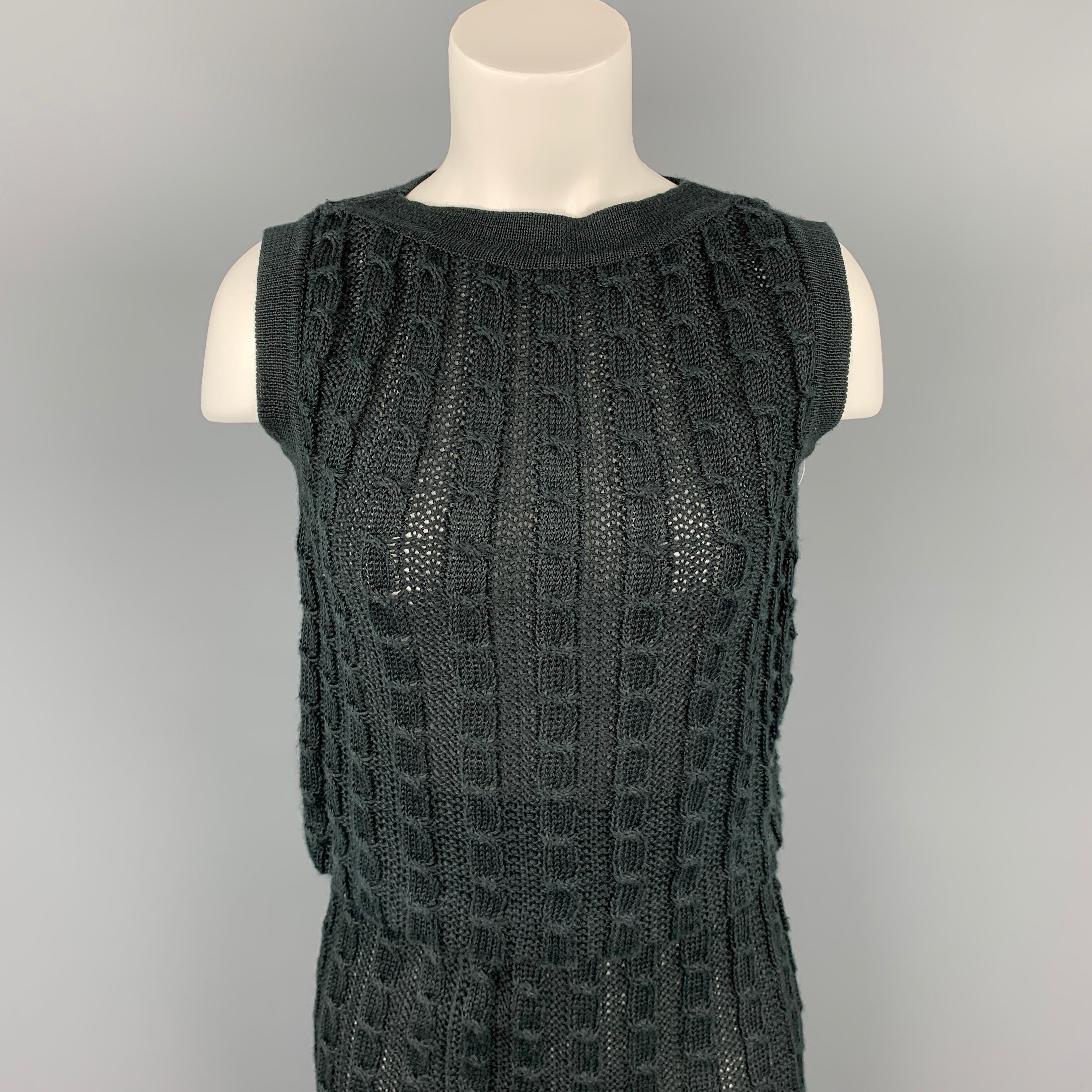 JUNKO SHIMADA skirt set comes in a charcoal knitted linen featuring a sleeveless style, crew-neck, and a match pencil skirt. Made in Japan.

Very Good Pre-Owned Condition.
Marked: 9

Measurements:

-Top
Shoulder: 14.5 in.
Bust: 32 in.
Length: 17.5