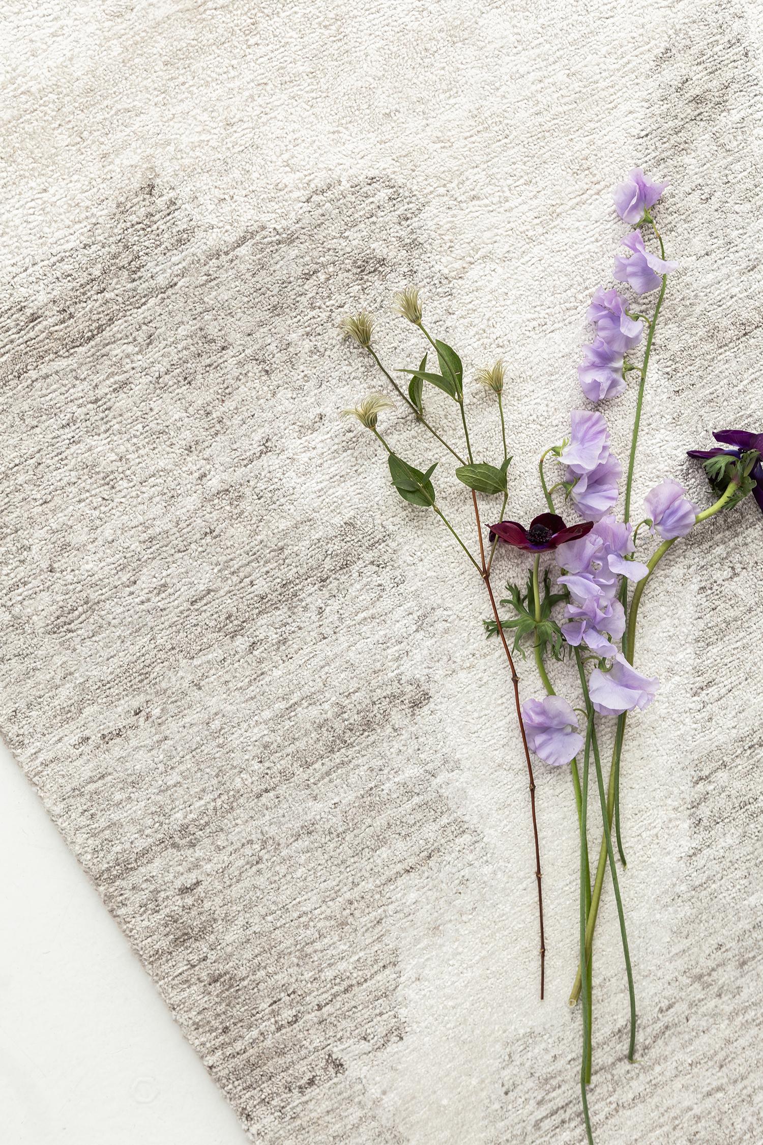 A chic Junmai Daiginho in Yokai Collection that is a perfect addition to a Minimalist modern design. Featuring the stunning shades of soft gray and frost white, this amazing rug boasts its mysterious art form creating an abstract liquefied effect