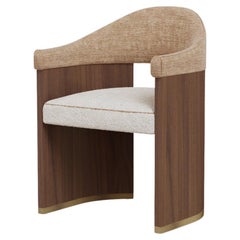Junna Dining Chair by Nolita Harbour in Bouclé Upholstery with Walnut
Brass.