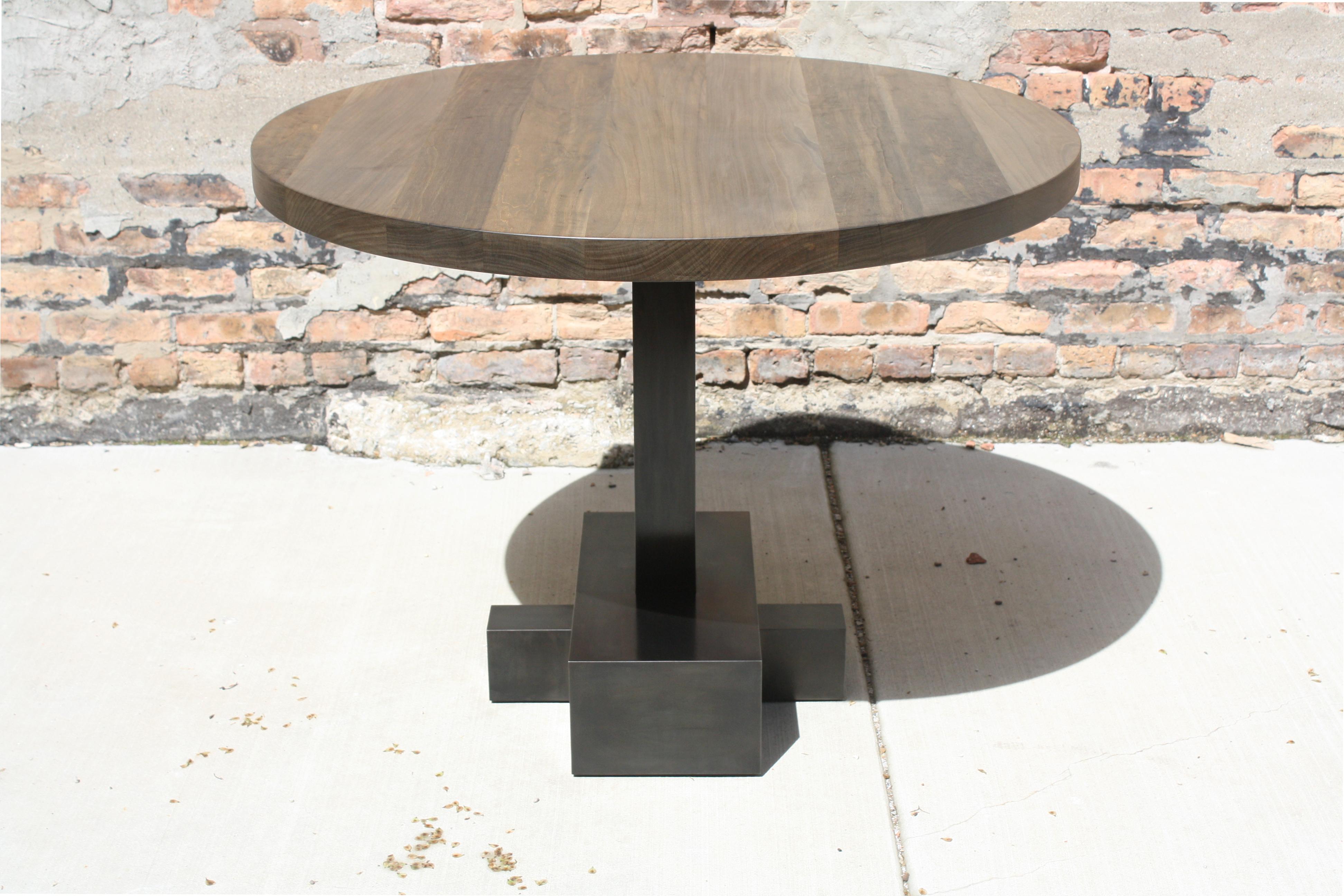 Shown in oxidized maple and blackened steel

Measures: 40” diameter x 29” high - square edge

This customizable pedestal table is shown with a seamlessly welded, blackened steel base with a 40” oxidized maple tabletop.

Available in custom