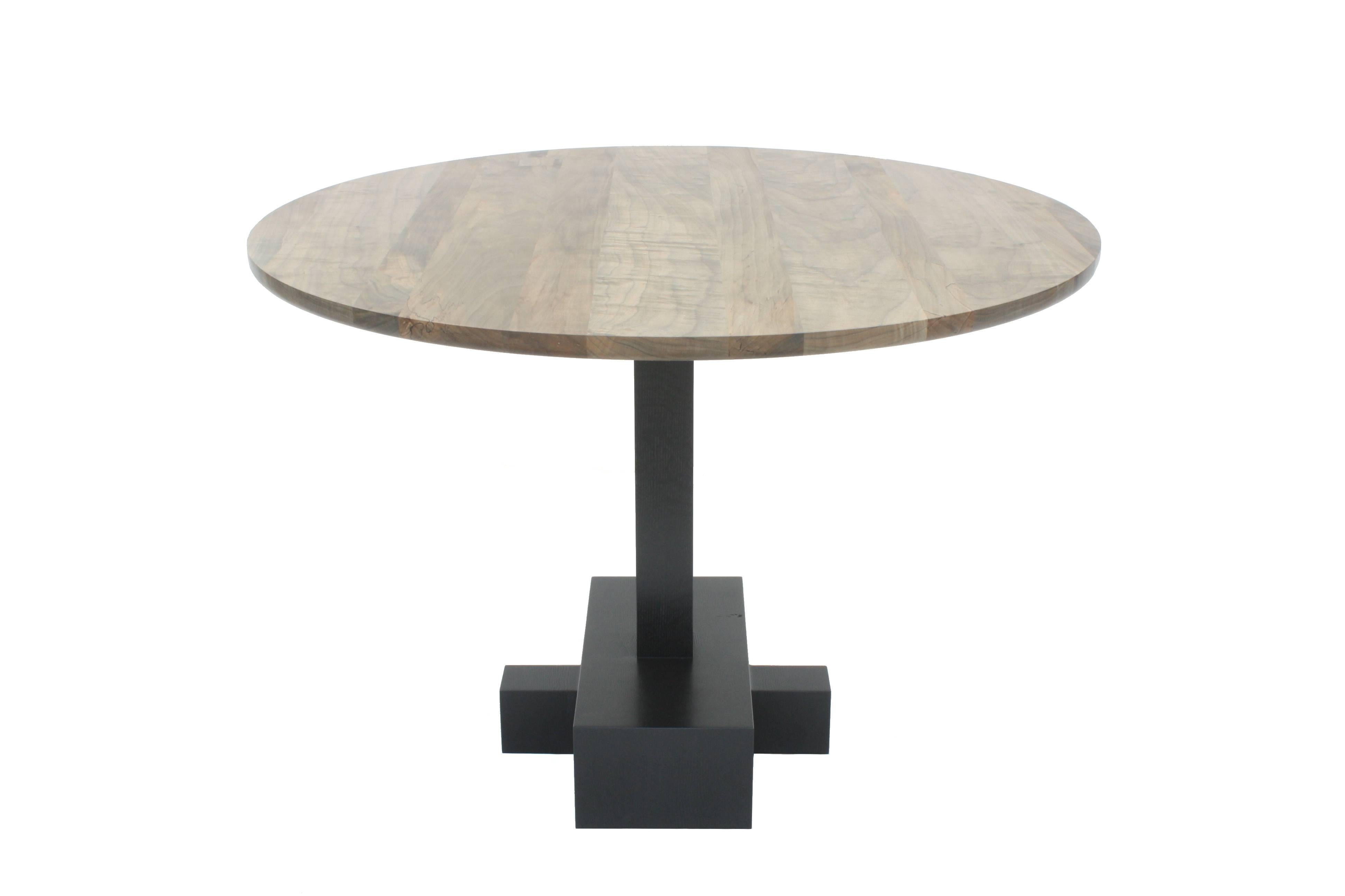 Handmade in Chicago by Laylo Studio, this customizable pedestal table features a stack laminated, solid wood pedestal base with an under-beveled, 42