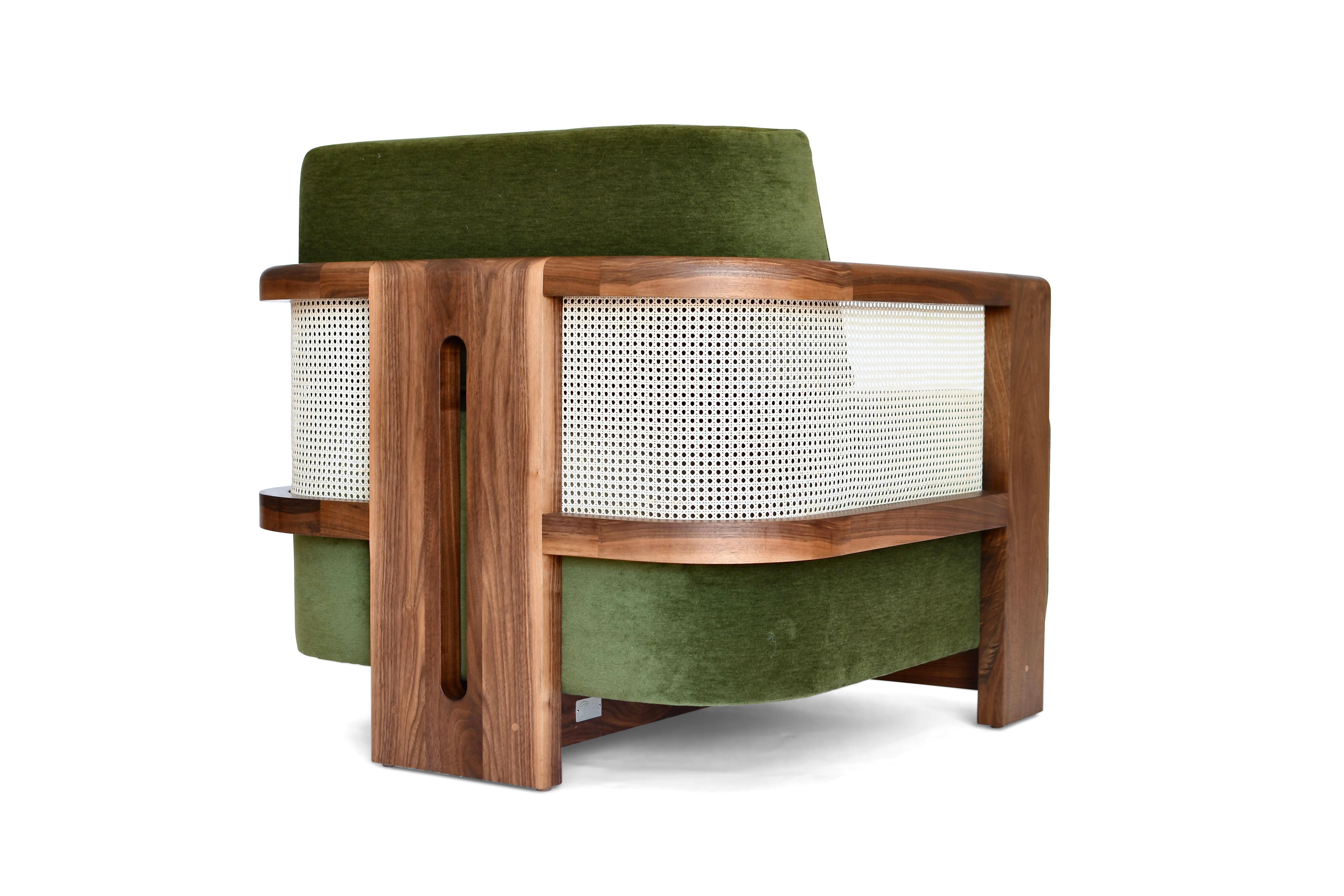 The Juno Lounge Chair and its modern silhouette embraces the masterful chair designs of the Brazilian Mid-Century Modern movement.

With the elegant detailing of the natural caned panels this gracefully curved, handcrafted solid wood frame commands