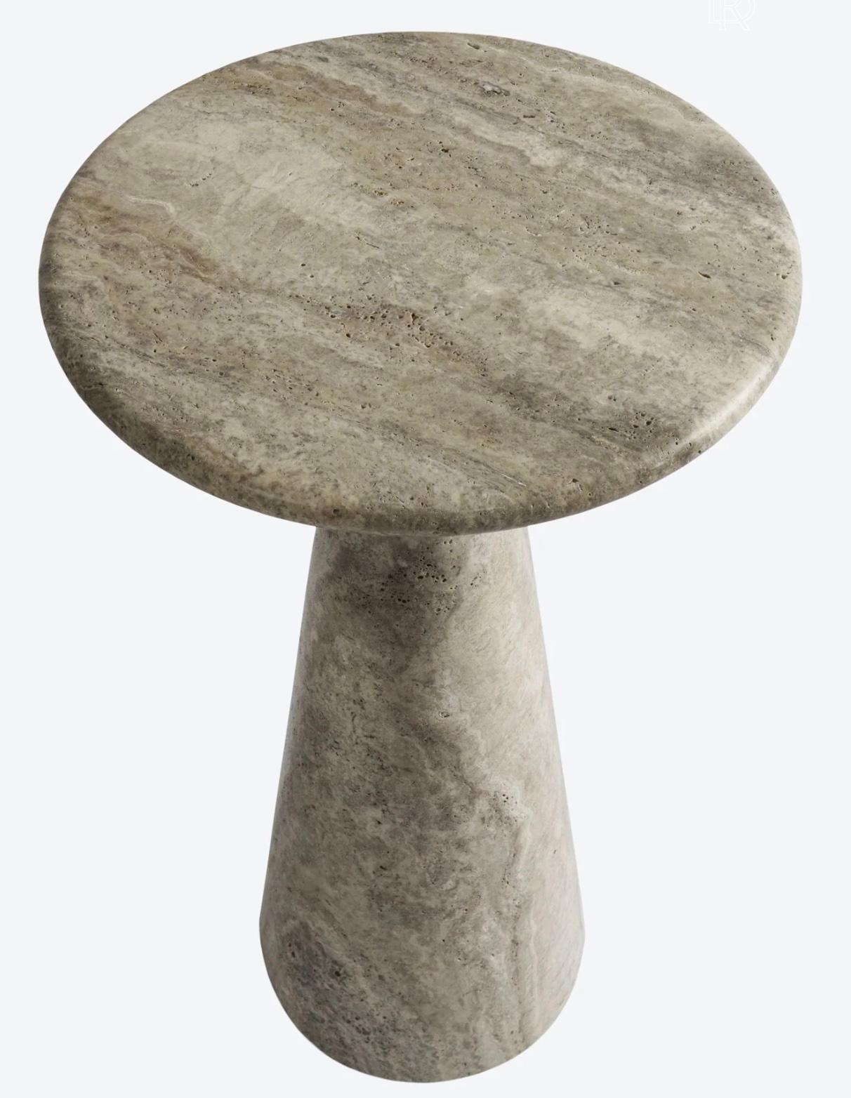 Our most versatile side table made of silver travertine. A simple elegant silhouette carved from a solid block of stone. This occasional stone table can be used virtually anywhere - next to a sofa, chair, bed, or bath. Sold individually, but can