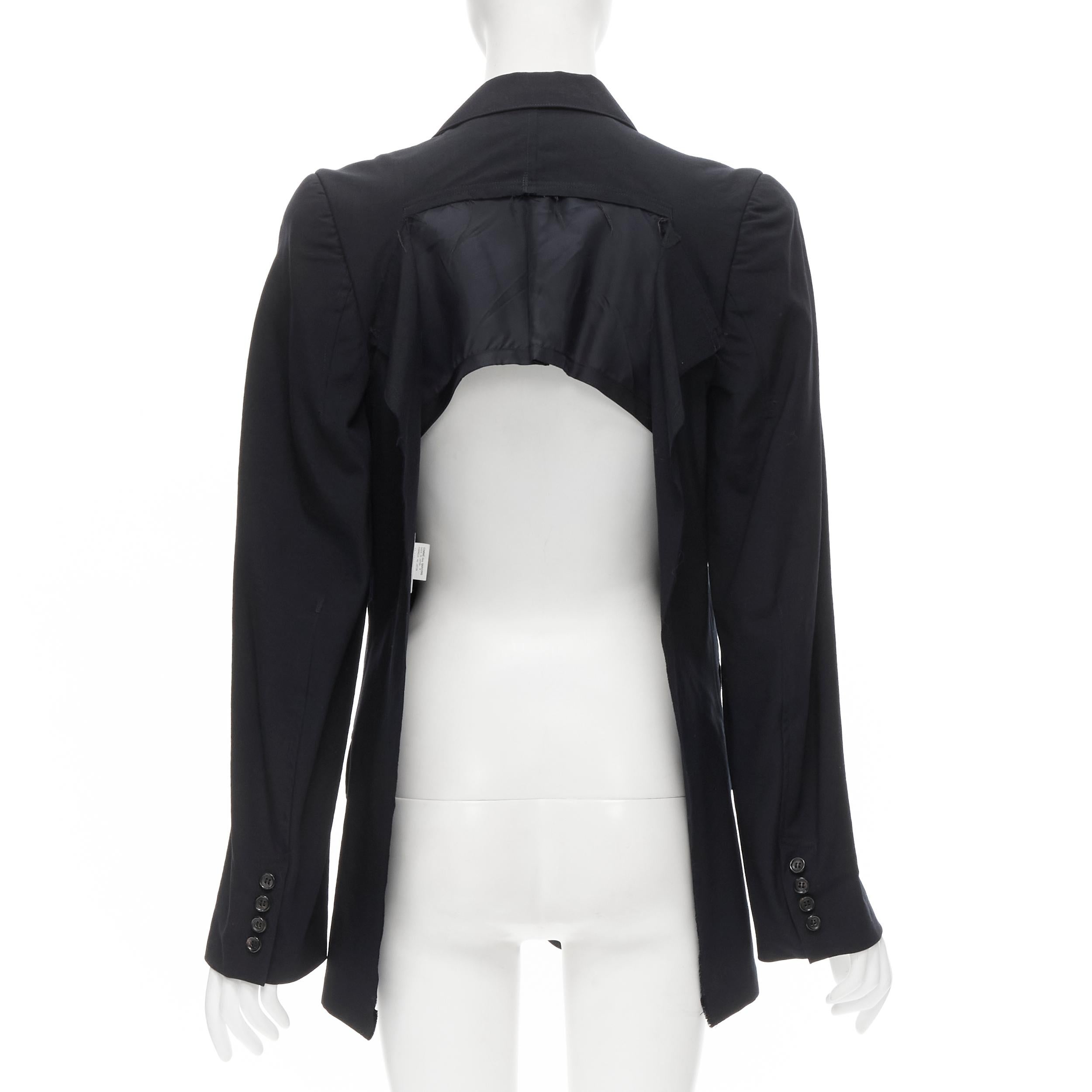 JUNYA WATANABE 1994 navy wool shoulder padded cut out back blazer M 
Reference: CRTI/A00319 
Brand: Junya Watanabe 
Designer: Junya Watanabe 
Collection: 1994 
Material: Wool 
Color: Navy 
Pattern: Solid 
Closure: Button 
Extra Detail: Padded