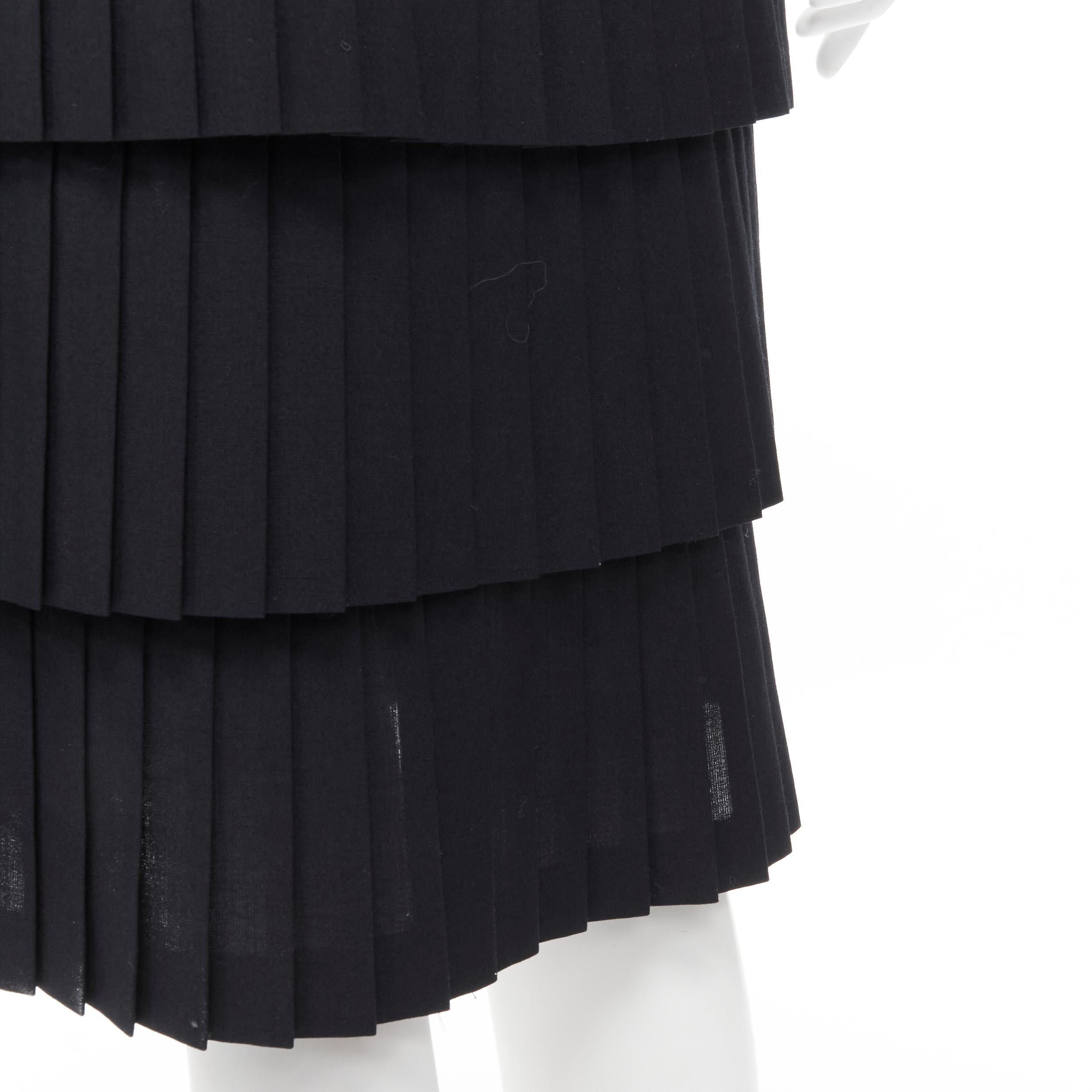 JUNYA WATANABE 1998 black pleated tiered hem pencil skirt S 
Reference: CRTI/A00310 
Brand: Junya Watanabe 
Designer: Junya Watanabe 
Collection: 1998 
Material: Polyester 
Color: Black 
Pattern: Solid 
Closure: Zip Extra Detail: Button zip side