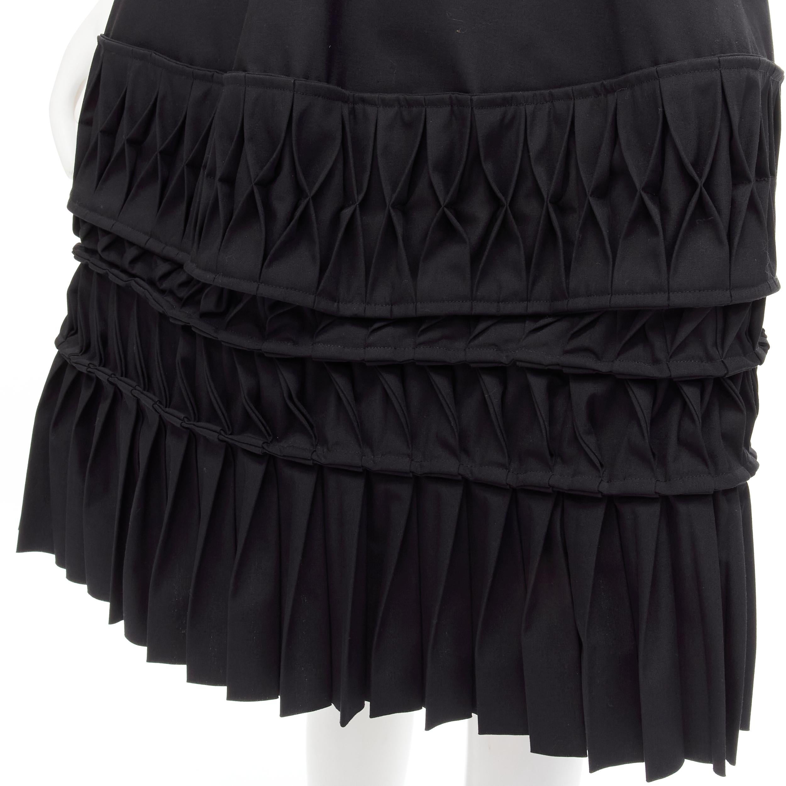 JUNYA WATANABE 1999 Runway Vintage black 3D origami pleated wrap skirt 
Reference: CRTI/A00642 
Brand: Junya Watanabe 
Collection: 1999 Runway 
Material: Polyester 
Color: Black 
Pattern: Solid 
Closure: Self tie 
Extra Detail: 3D origami pleat
