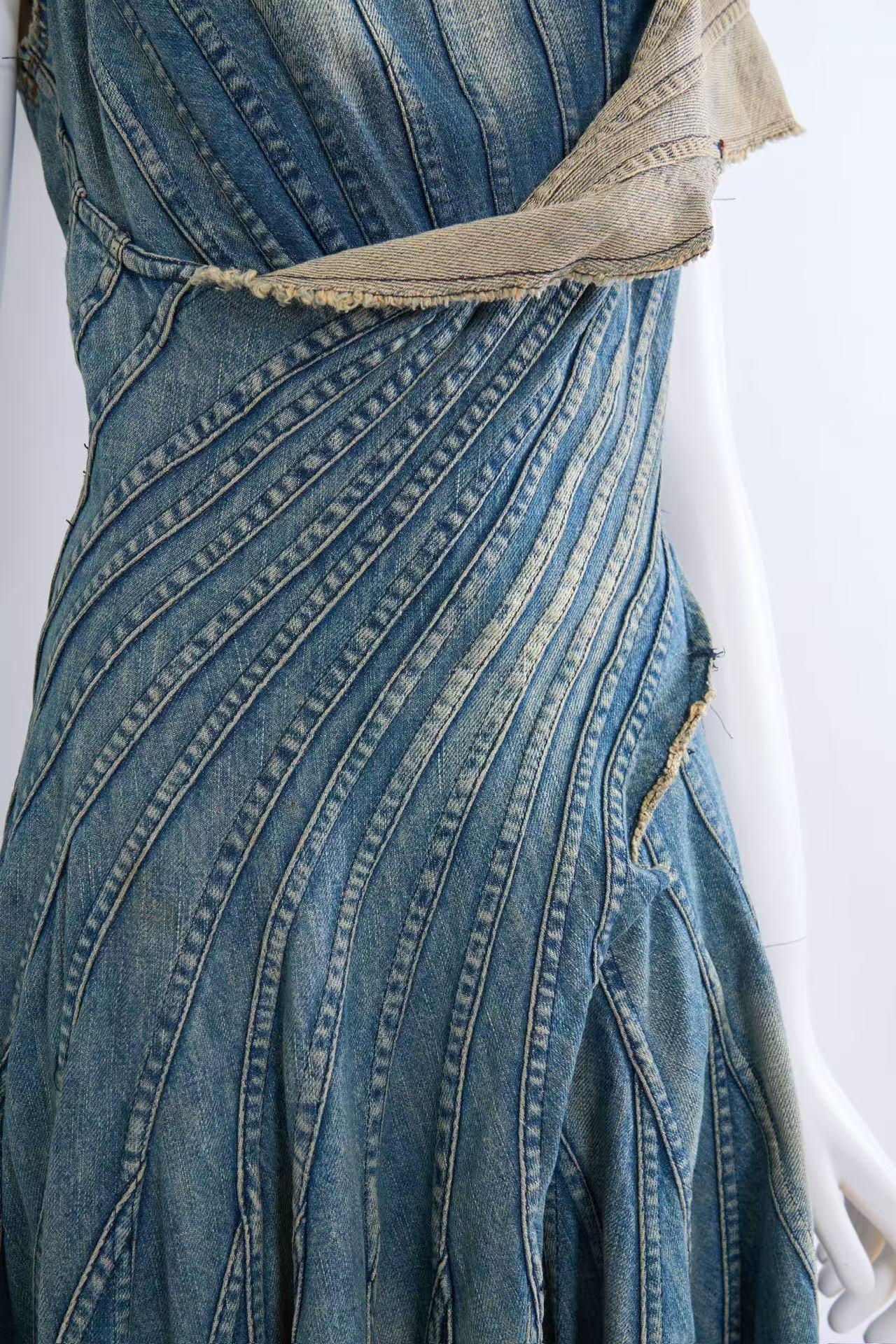 Junya Watanabe 2002 Denim Runway Dress

This exceptional Junya Watanabe runway dress, labeled for Comme des Garçons, epitomizes avant-garde design and craftsmanship. Crafted from high-quality Japanese denim, this size M piece features intricately