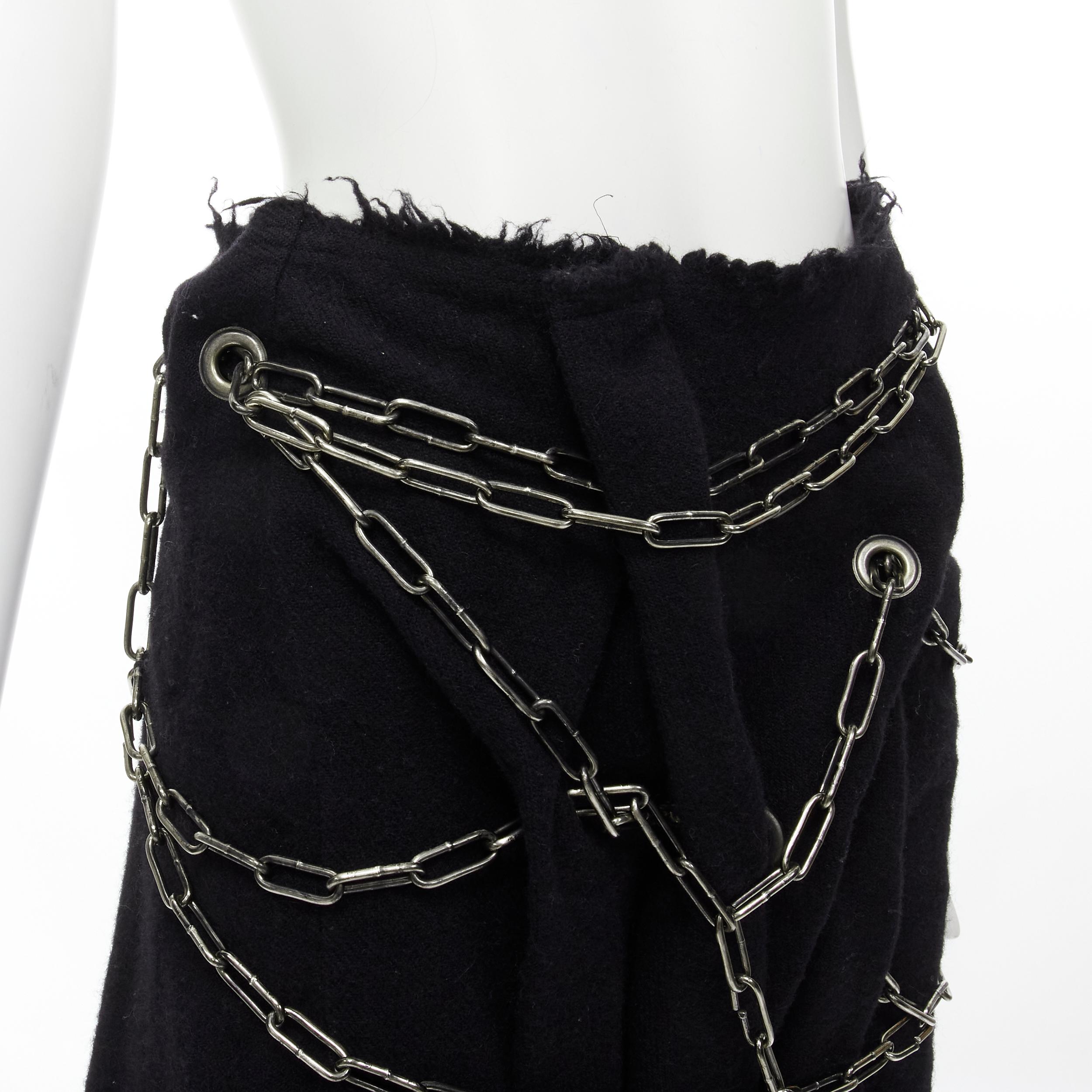JUNYA WATANABE 2003 black boiled wool frayed edge silver punk chain midi skirt S 
Reference: CRTI/A00564 
Brand: Junya Watanabe 
Collection: 2003 Runway 
Material: Wool 
Color: Black 
Pattern: Solid 
Closure: Zip 
Extra Detail: Silver-tone chain