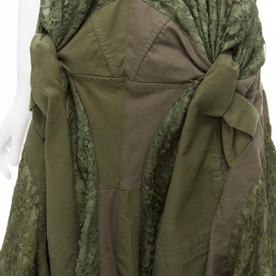 JUNYA WATANABE 2006 Runway military  green lace deconstructed dress XS
Reference: CRTI/A00680
Brand: Junya Watanabe
Designer: Junya Watanabe
Collection: AD2006 - Runway
Material: Cotton, Lace
Color: Green
Pattern: Solid
Closure: Zip
Extra Details: