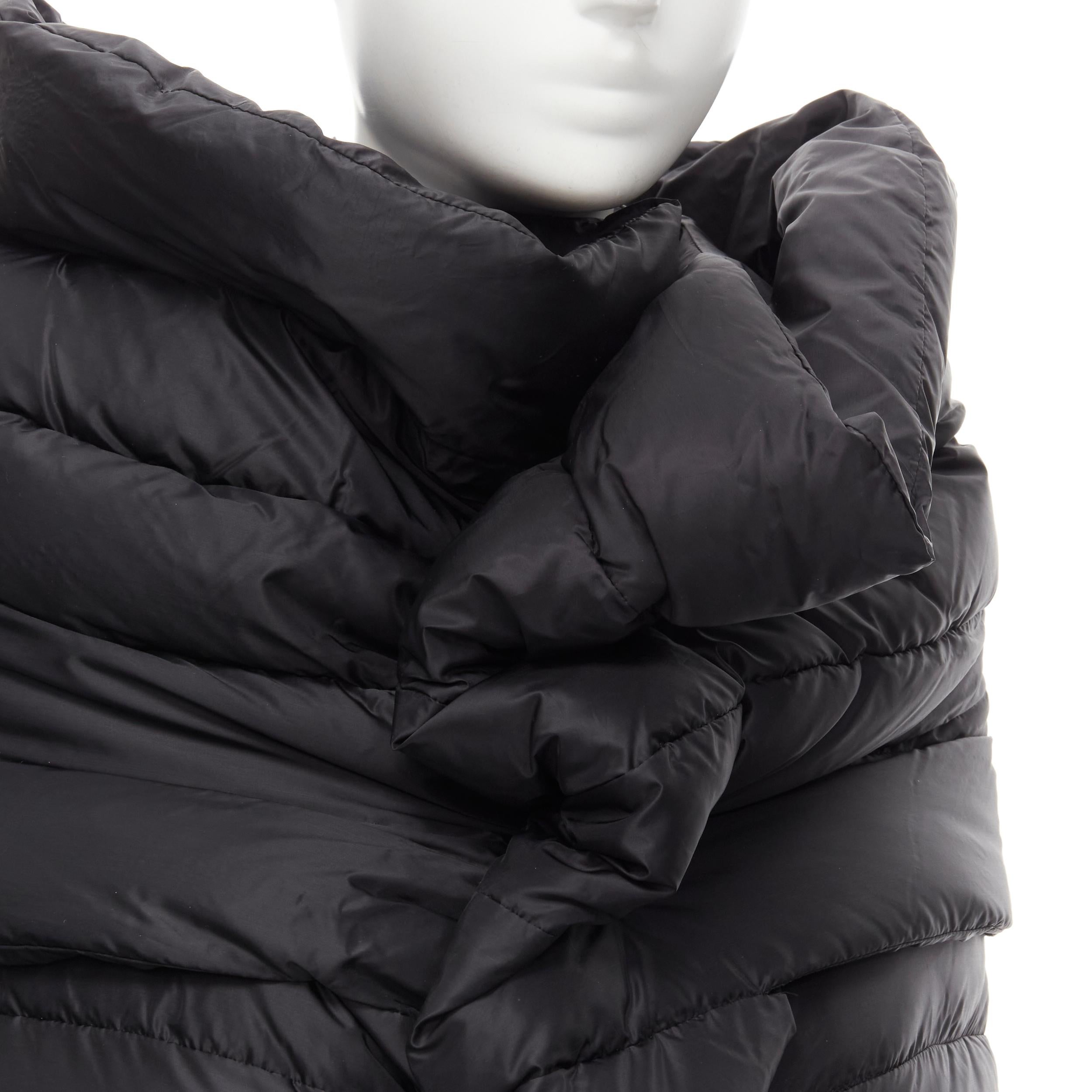JUNYA WATANABE 2009 black nylon down puffer wrap cocoon coat XS 
Reference: CRTI/A00526 
Brand: Junya Watanabe 
Collection: 2009 
Material: Nylon 
Color: Black 
Pattern: Solid Closure: Snap 
Extra Detail: Down feather puffer. 
Made in: Japan