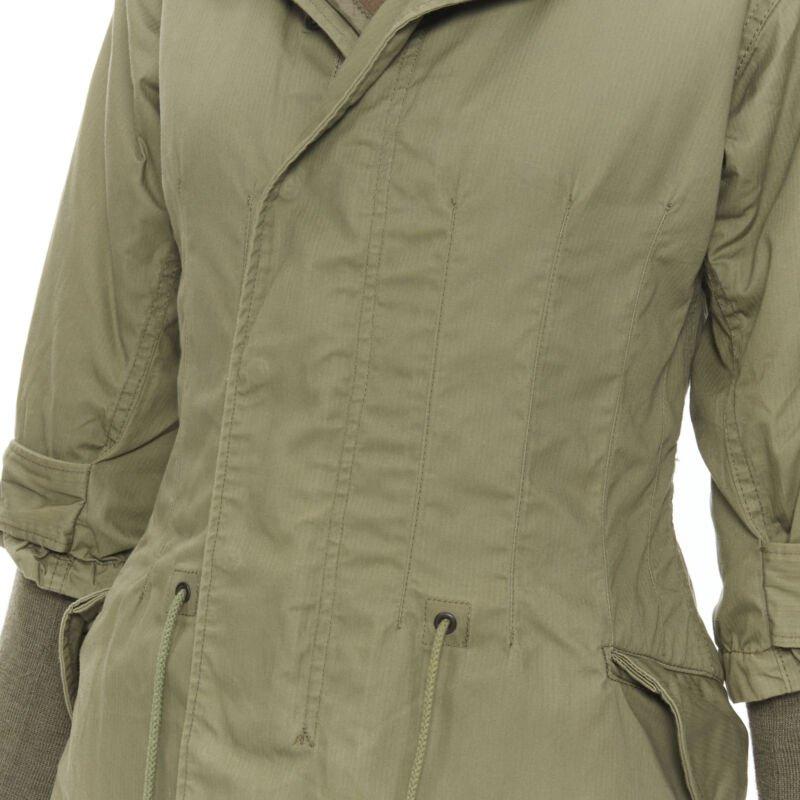 JUNYA WATANABE 2010 green cotton fitted waist fisherman parka coat XS
Reference: TGAS/B01714
Brand: Junya Watanabe
Designer: Junya Watanabe
Model: Military parka coat
Collection: 2010
Material: Cotton
Color: Green
Pattern: Solid
Lining:  Wool
Extra