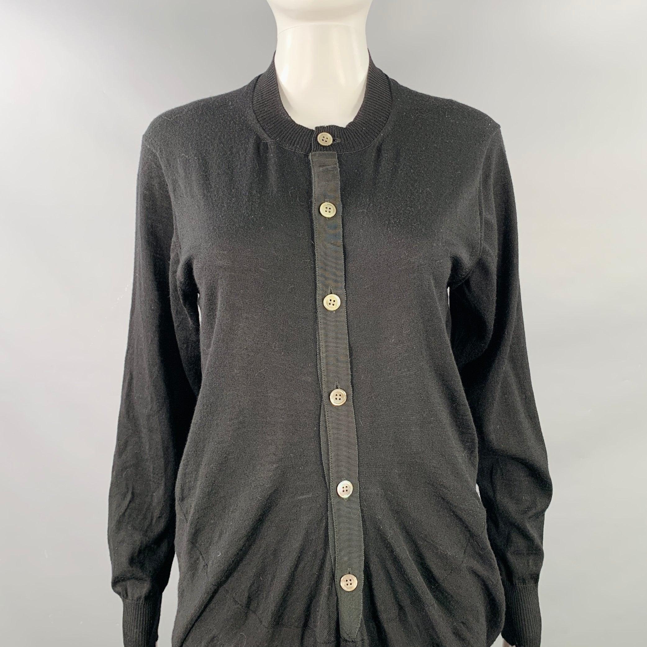 JUNYA WATANABE 2011 dress
in a black wool jersey featuring a collarless style, long sleeves, and long placket button closure. Made in Japan.Excellent Pre-Owned Condition. 

Marked:   size not marked 

Measurements: 
 
Shoulder: 16 inches Bust: 39
