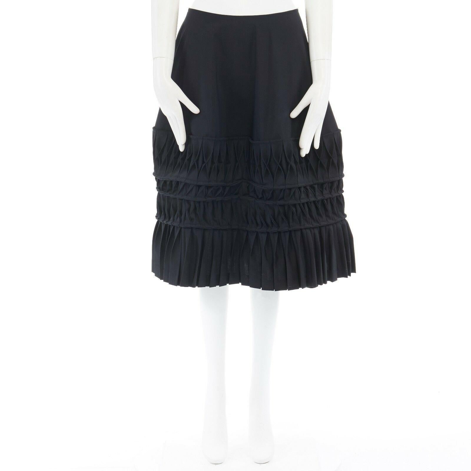 JUNYA WATANABE AD1998 black wool blend origami pleated front wrap tie skirt 
Reference: CRTI/A00139 
Brand: Junya Watanabe 
Designer: Junya Watanabe Collection: AD1998 
Material: Wool 
Color: Black 
Pattern: Solid 
Extra Detail: FROM THE AD1998