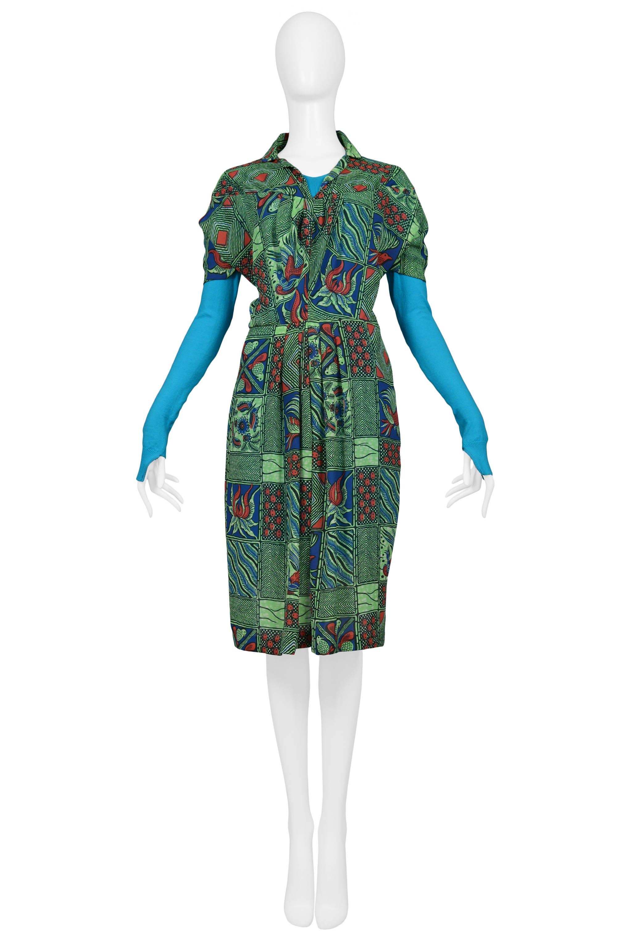 Resurrection Vintage is excited to offer a vintage Junya Watanabe Afrikaans panel shirt dress featuring bright blue knit sleeves and back panel, collar, and pleats. Collection 2009.

Junya Watanabe
Size: Small
Knit and Woven Polyester
2009