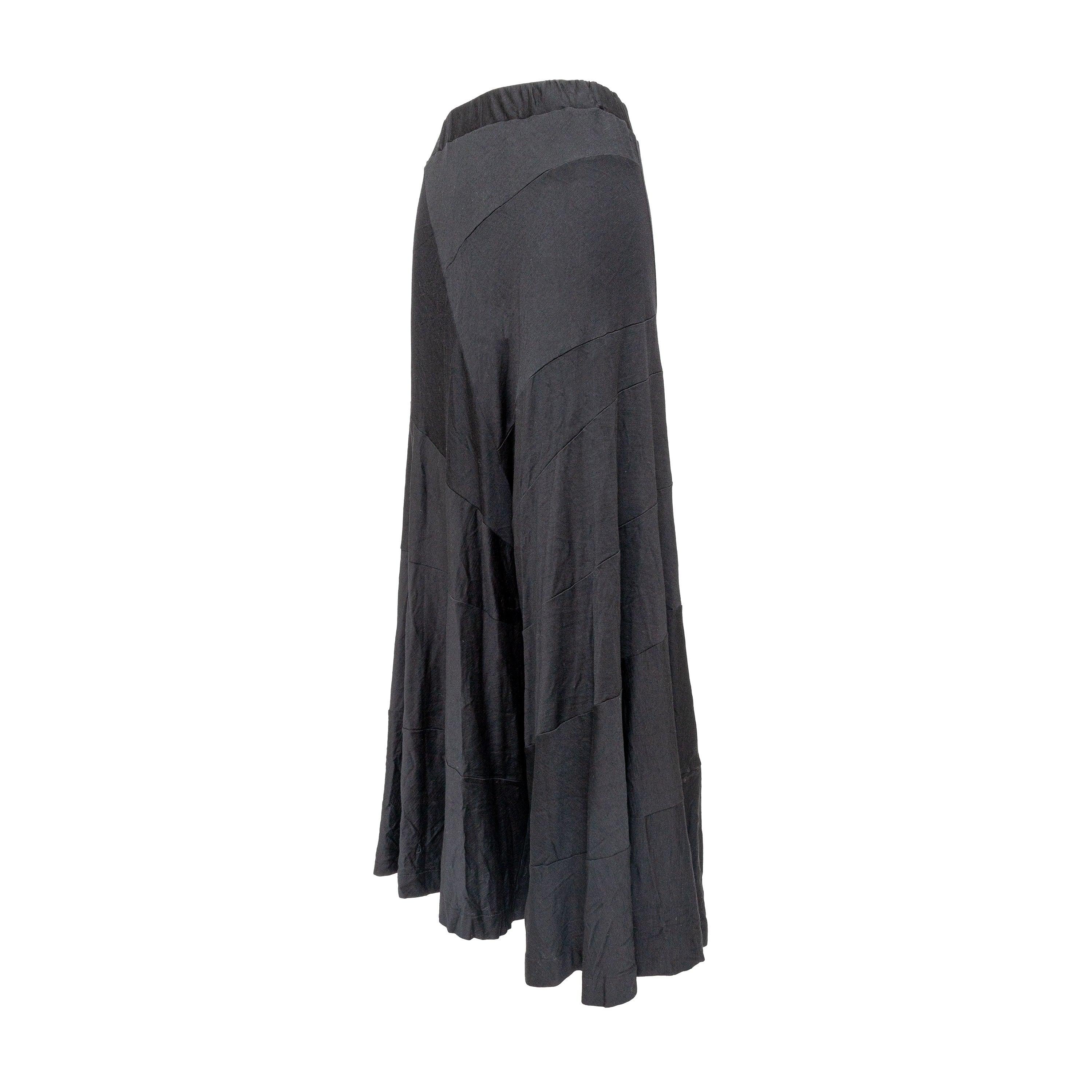 Effortlessly chic and comfortable, the Junya Watanabe Asymmetric Loose Trousers are designed in a palazzo style with a skirt-like flow. Made with soft, breathable cotton and featuring panel stitching and an elastic waist, these trousers offer both