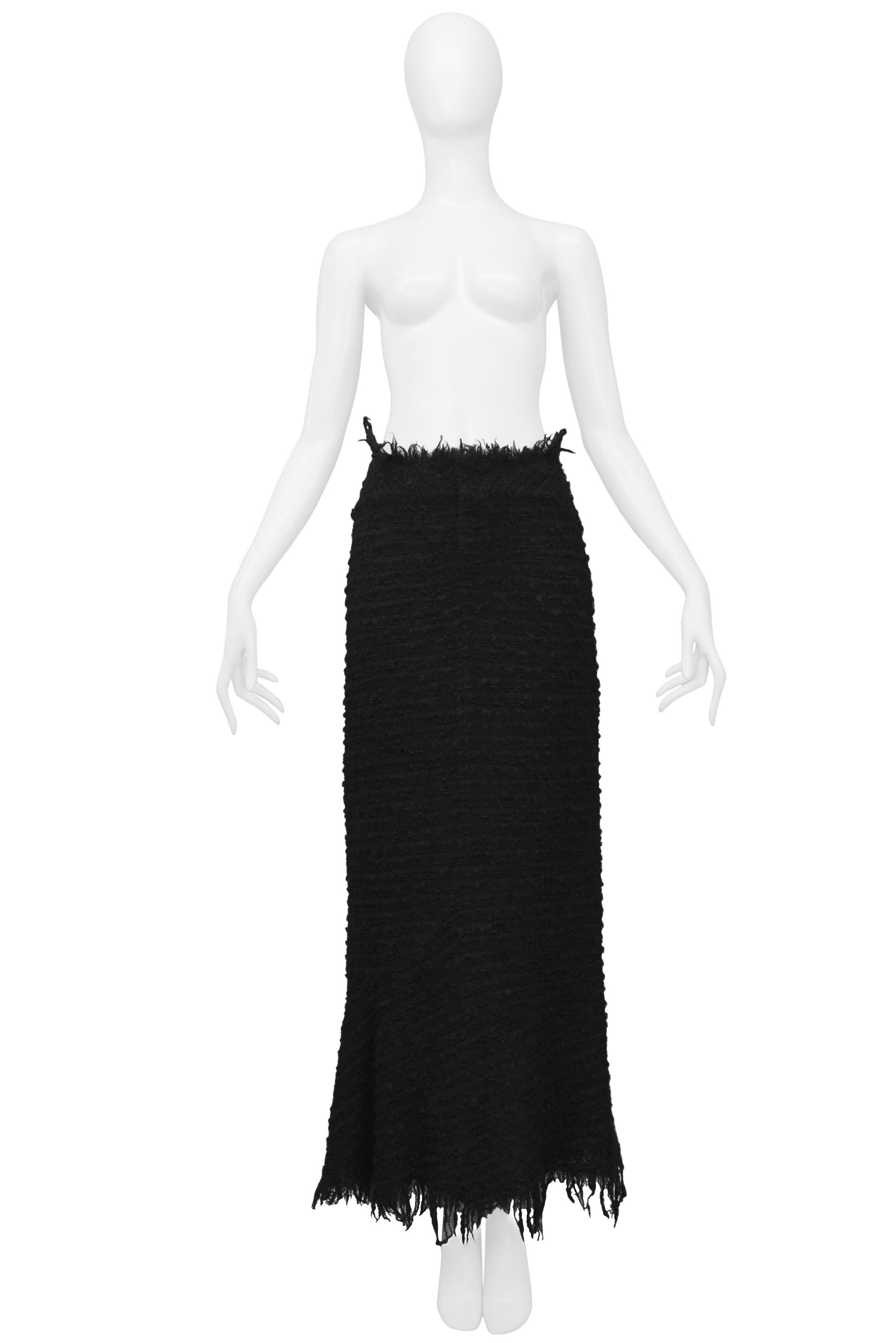 Resurrection Vintage is excited to offer a vintage Junya Watanabe for Comme des Garcons black boucle maxi skirt with raw edges at the waist and the hem. 

Junya Watanabe
Size: Small
Boucle
Excellent Vintage Condition
Authenticity Guaranteed