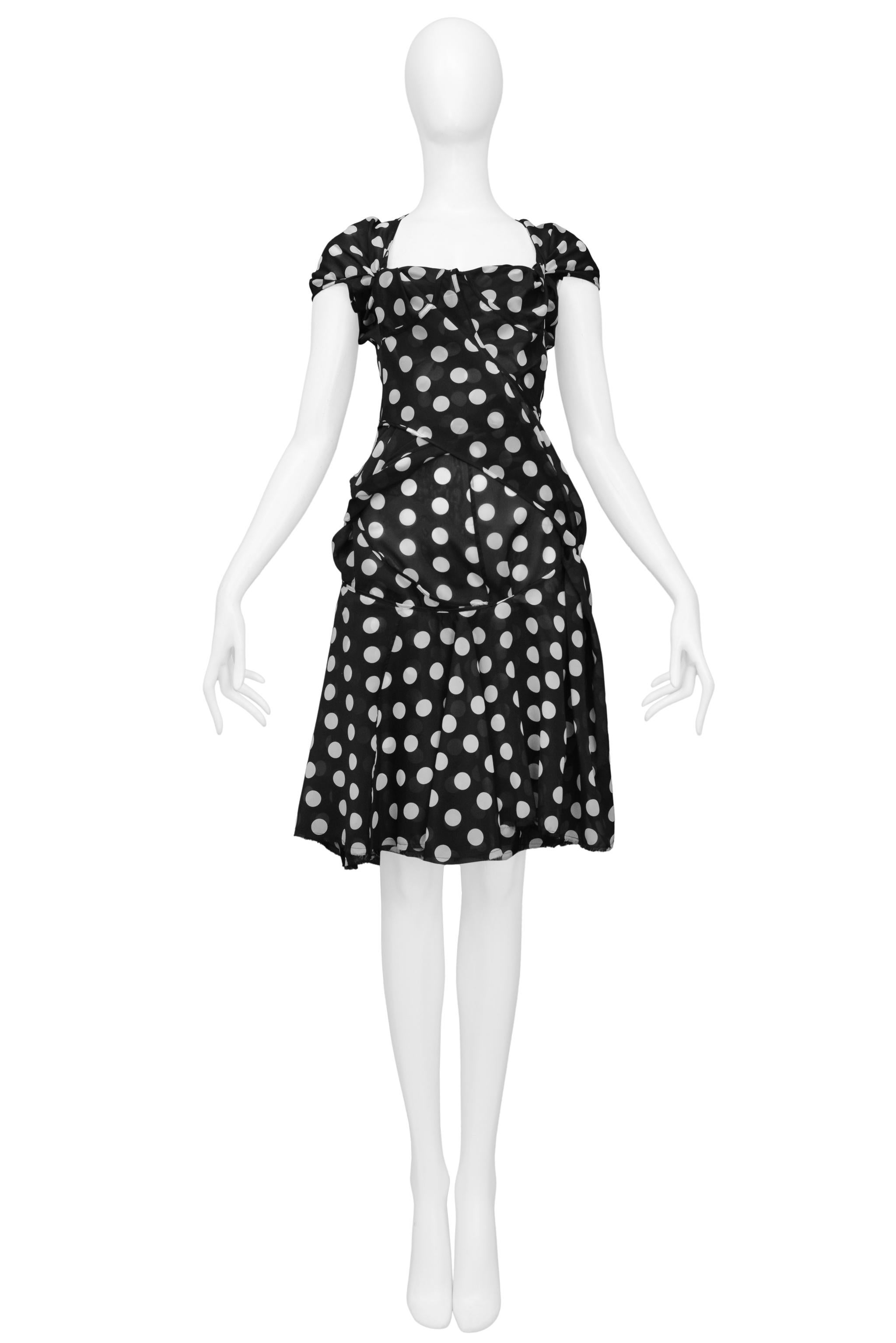 Resurrection Vintage is excited to offer a vintage Junya Watanabe for Comme des Garcons black and white polka dot day dress featuring concept draping and back cutout. 

Junya Watanabe
Size: Small
Poly 
2004 Collection
Excellent Vintage