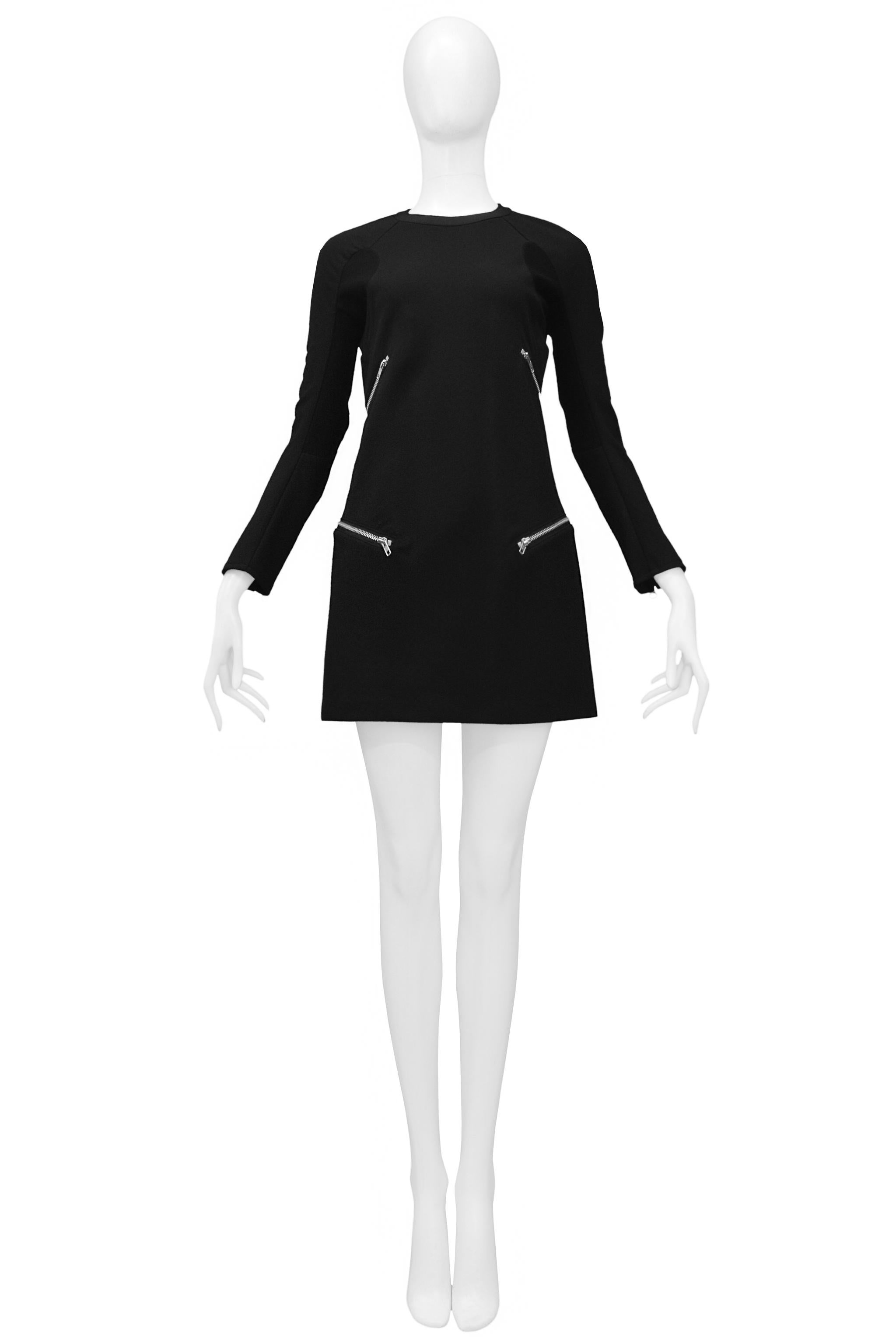 Resurrection Vintage is excited to offer a vintage Junya Watanabe black wool long sleeve dress featuring exposed zippers on the front sides and sleeves.

Junya Watanabe
Size: XS
Wool and Polyester Knit
2013 Collection
Excellent Vintage