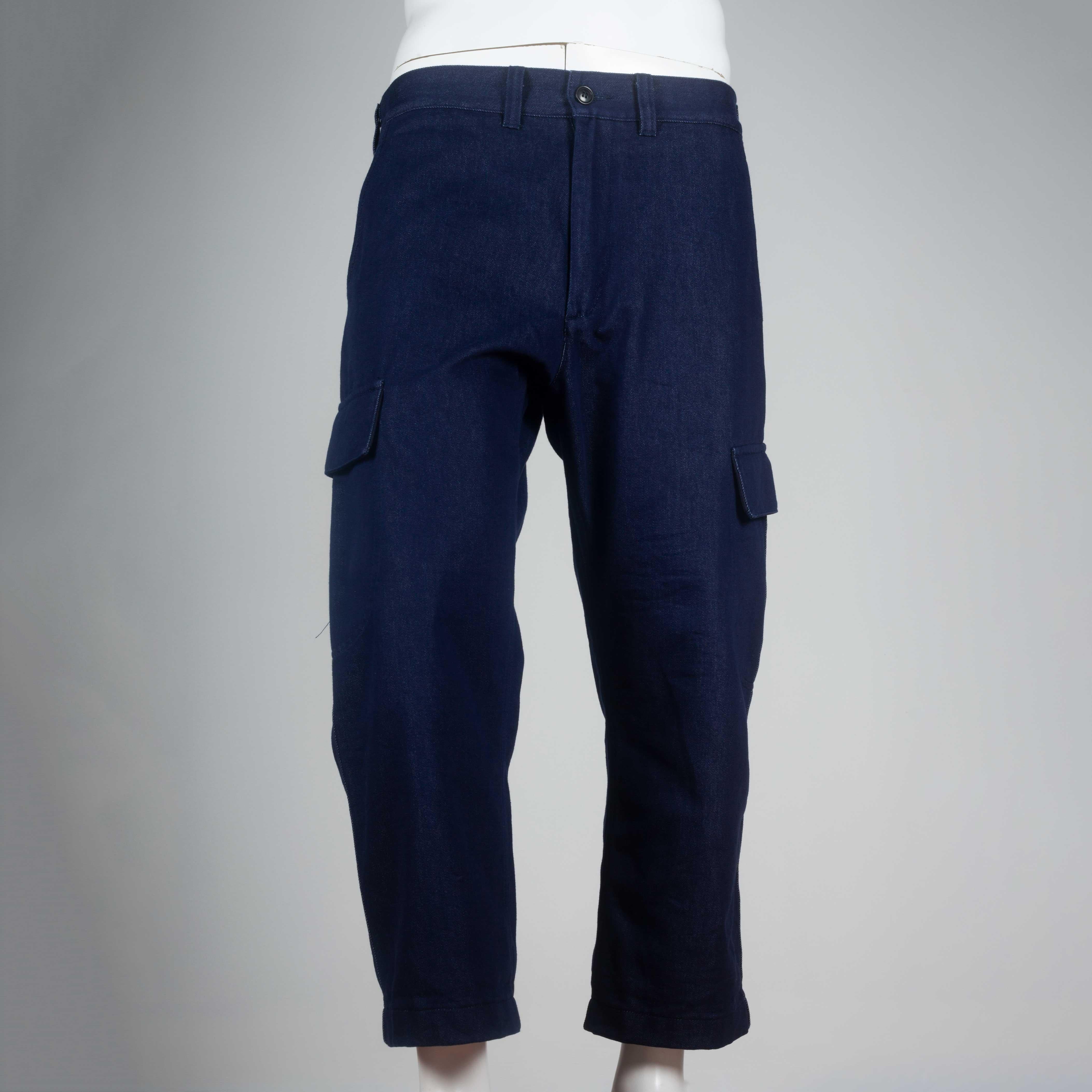 Junya Watanabe Comme des Garçons Man 2016, cargo pants from Japan in deep indigo denim. Minimalist feel to a maximalist function, the simple boxy pockets on each lower thigh complete the design. 

YEAR: 2016
MARKED SIZE: L
US MEN'S: M
US WOMEN'S: