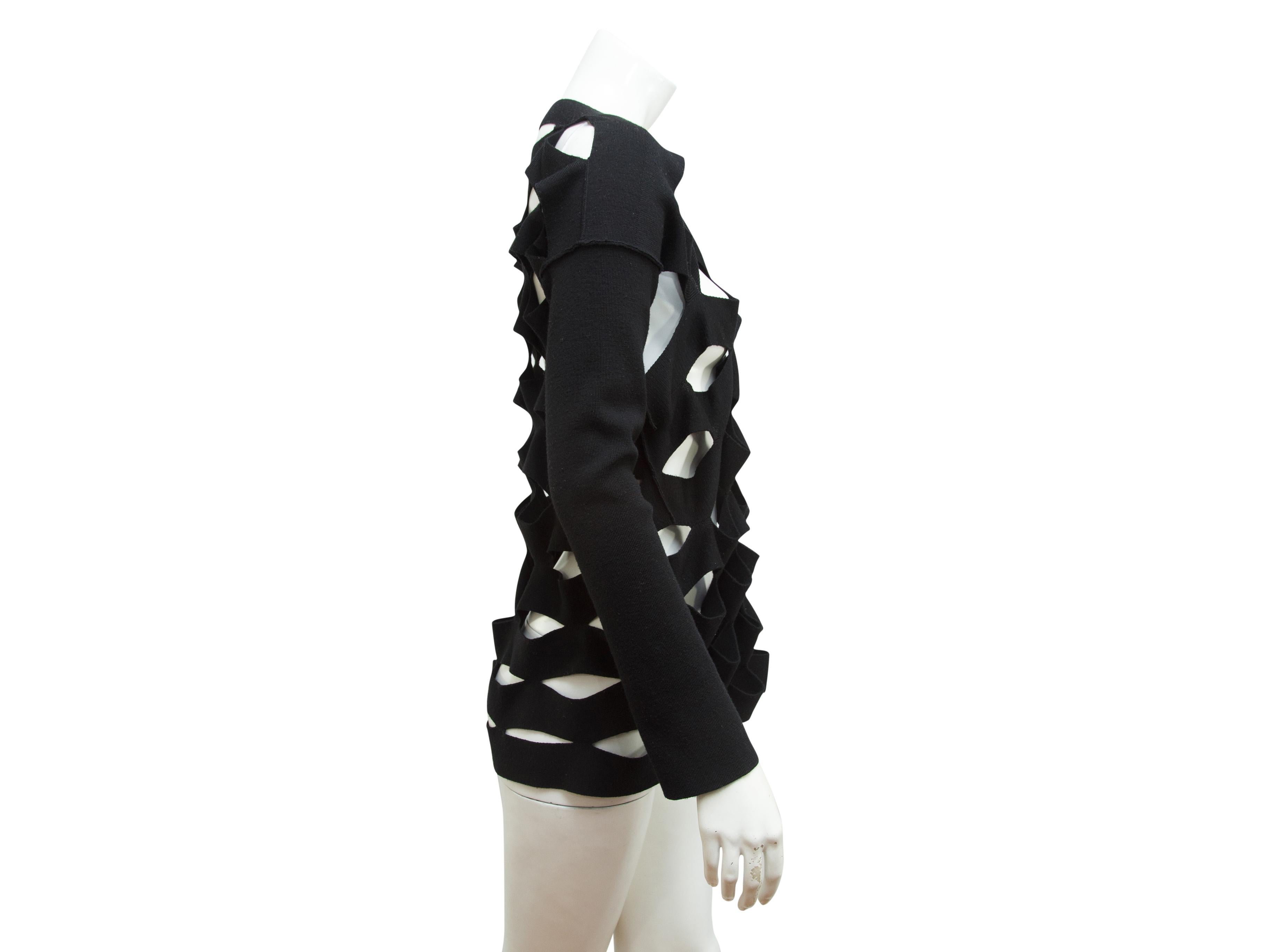 Product details:  Black cutout wool sweater by Junya Watanabe Comme des Garcon.  Boatneck.  Long sleeves.  Pullover style.  27