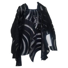Blusa de malla con lentejuelas y patchwork negro de Junya Watanabe Comme des Garçons, otoño de 2014