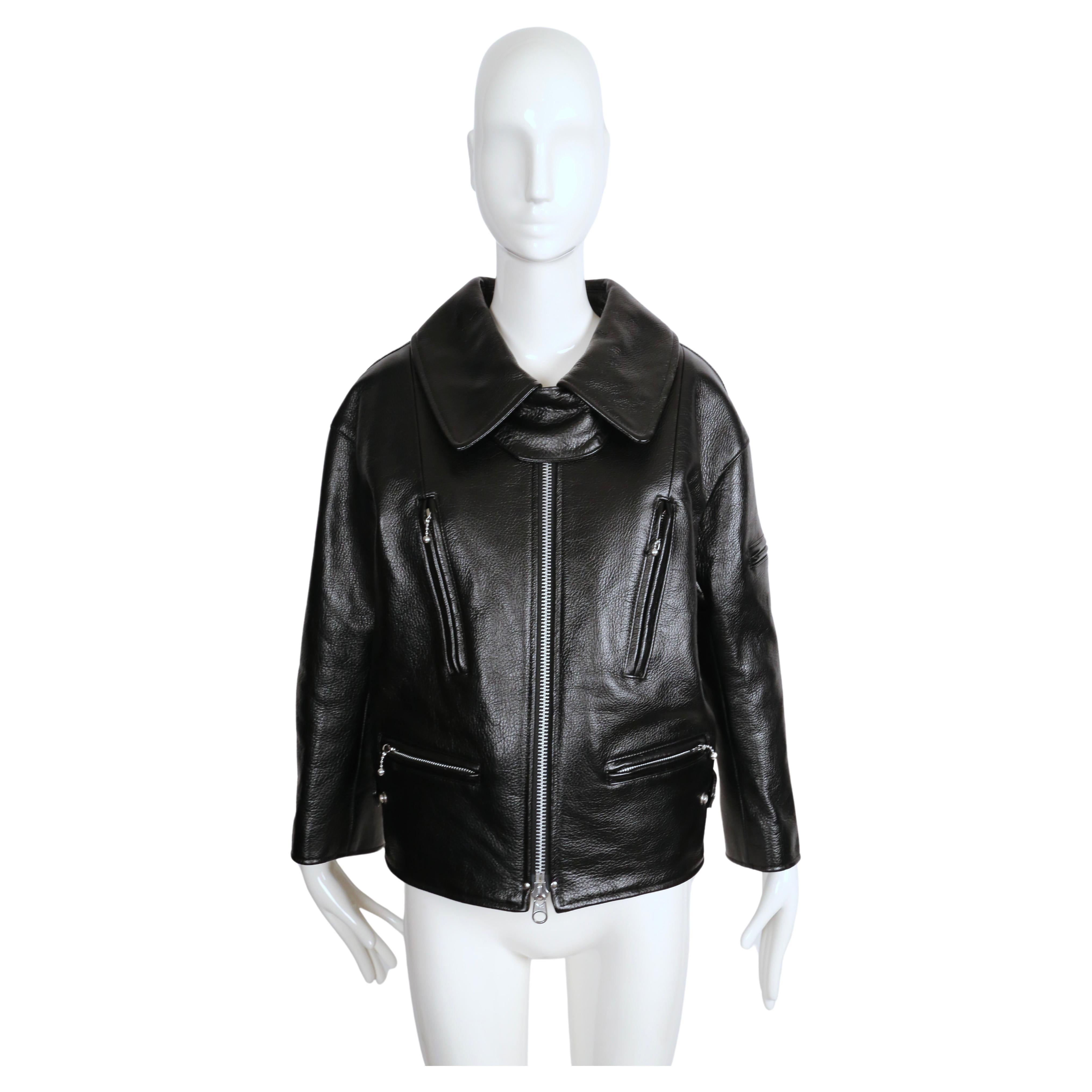 Jet-black, heavy grained leather jacket with portrait collar, zipper details and cinched sides from Junya Watanabe for Comme des Garcons. Labeled a Japanese size 'L' however this fits more like a M unless you are very petite. The fit is intended to