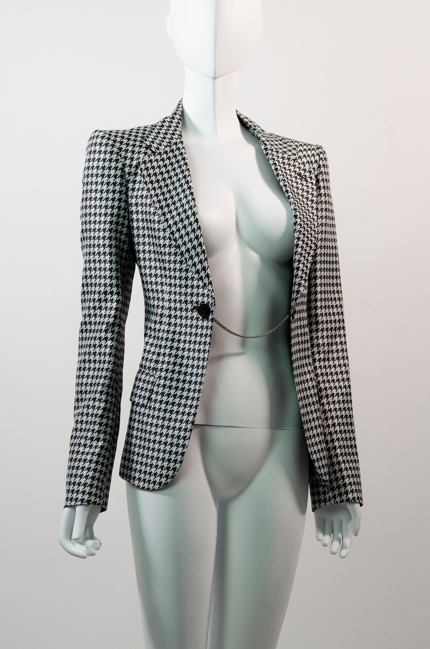 Insane houndstooth blazer by Junya Watanabe from his 2010 spring collection.

Tailored to perfection, this blazer is a work of art! This collection which focused on menswear for women was a perfect mix of avant-garde and utilitarian. Made from a