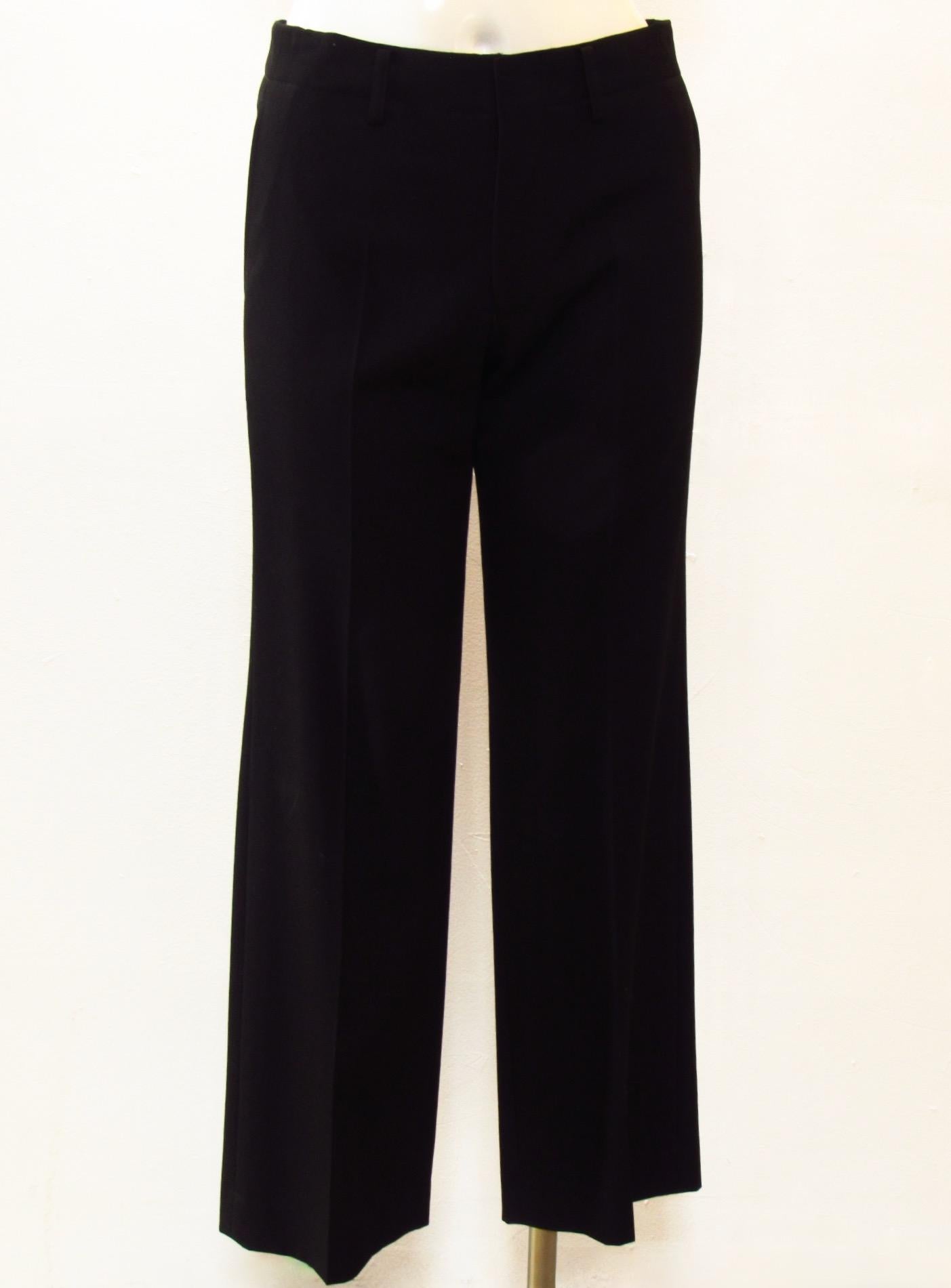 Classic black pants from vintage Junya Watanabe Comme des Garçons are 100% wool with front and back pockets and zip fly.